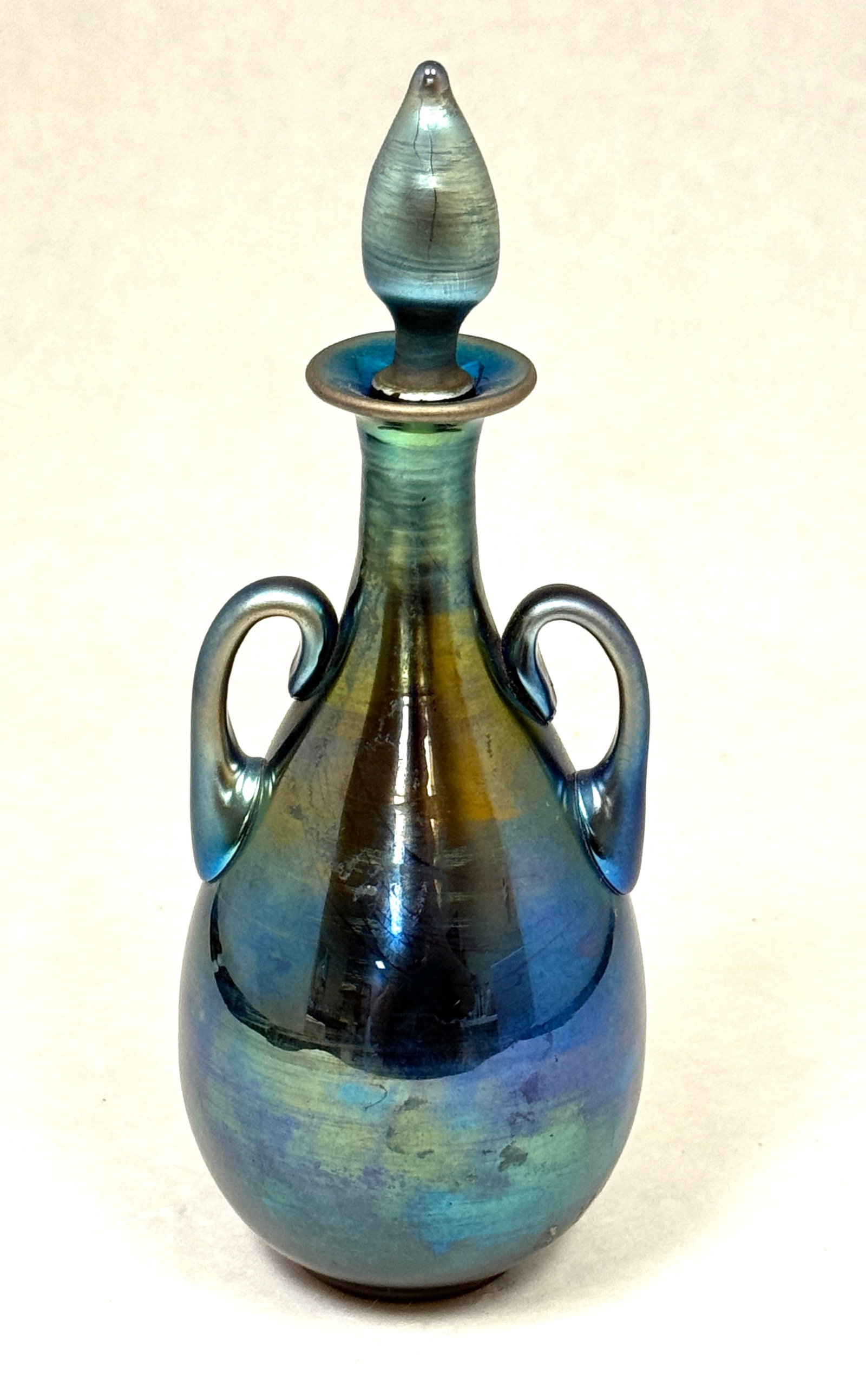 Steuben 2 Handle Blue Aurene: Steuben two handle Blue Aurene perfume bottle signed Aurene 3048, 6 3/4" ht. CONDITION: no chips, cracks, repairs, or material defects found, Jaremos attempts to call any material flaw that affects