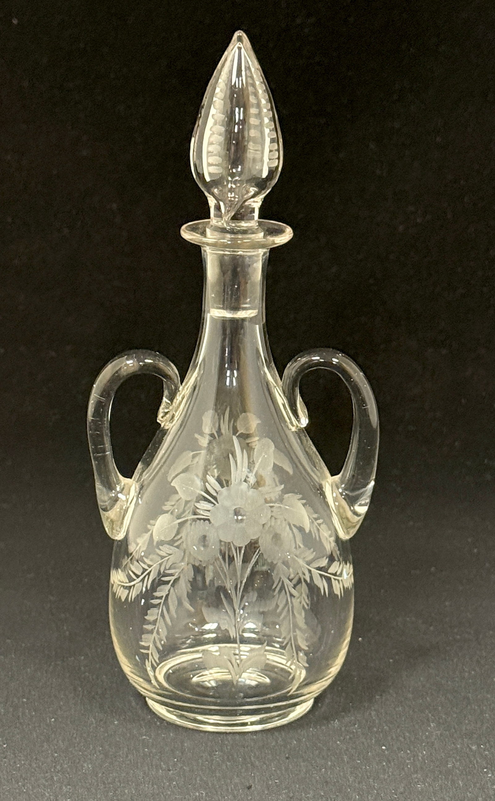 Steuben Etched Perfume: Steuben two handle clear perfume with etched flowers, shape 3048, 6 3/4" ht. CONDITION: no chips, cracks, repairs, or material defects found, Jaremos attempts to call any material flaw that affects