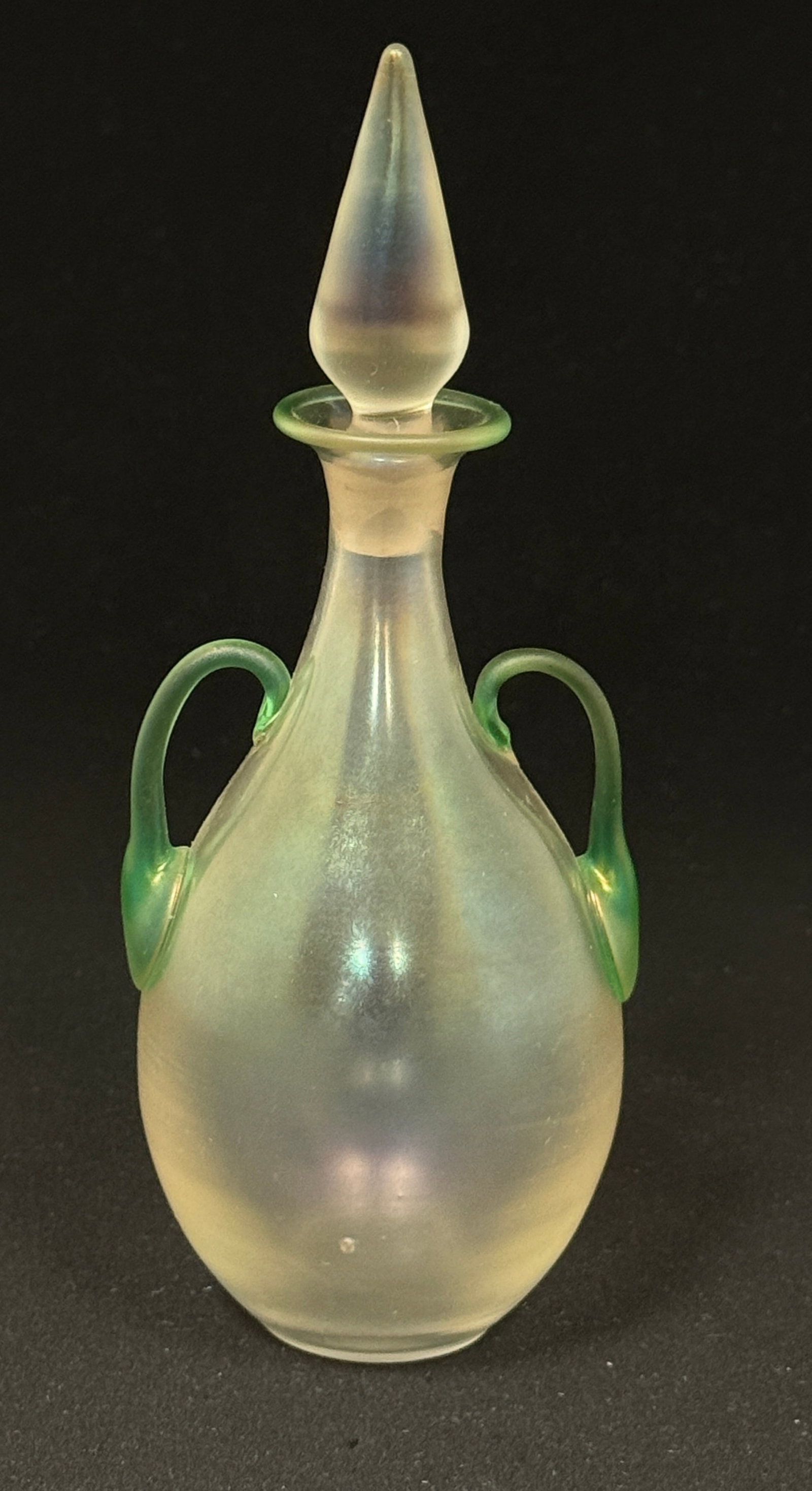 Steuben 2 Handle Perfume: Steuben Verre-de-Soie perfume bottle with green handles and a flame stopper, 6 3/4" ht. CONDITION: no chips, cracks, repairs, or material defects found, Jaremos attempts to call any material flaw