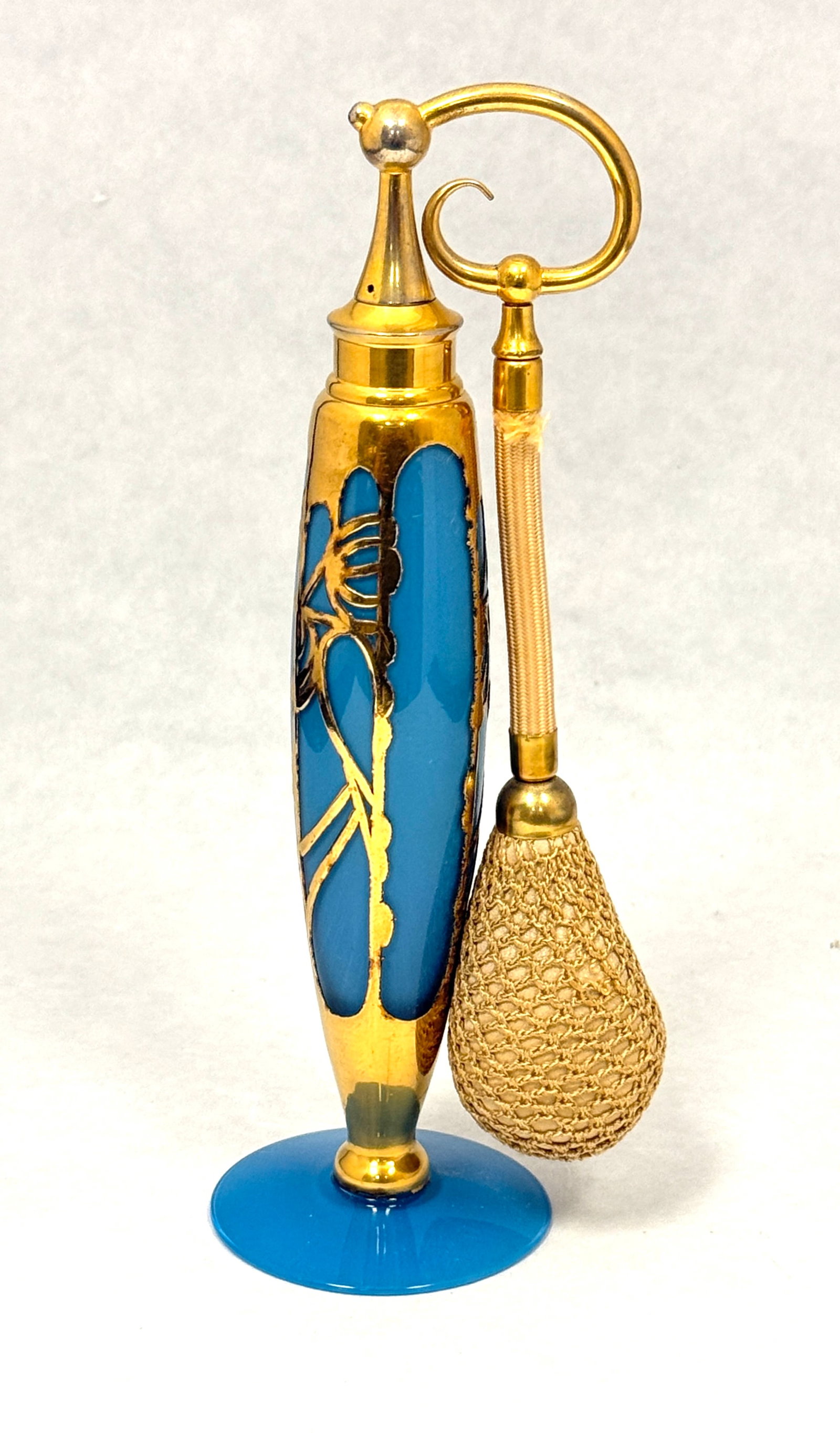 DeVilbiss Elegant Blue Perfume: DeVilbiss Elegant Line blue perfume decorated with an Art Deco gold metal design, 7 1/2" ht. CONDITION: no chips, cracks, repairs, or material defects found, Jaremos attempts to call any material