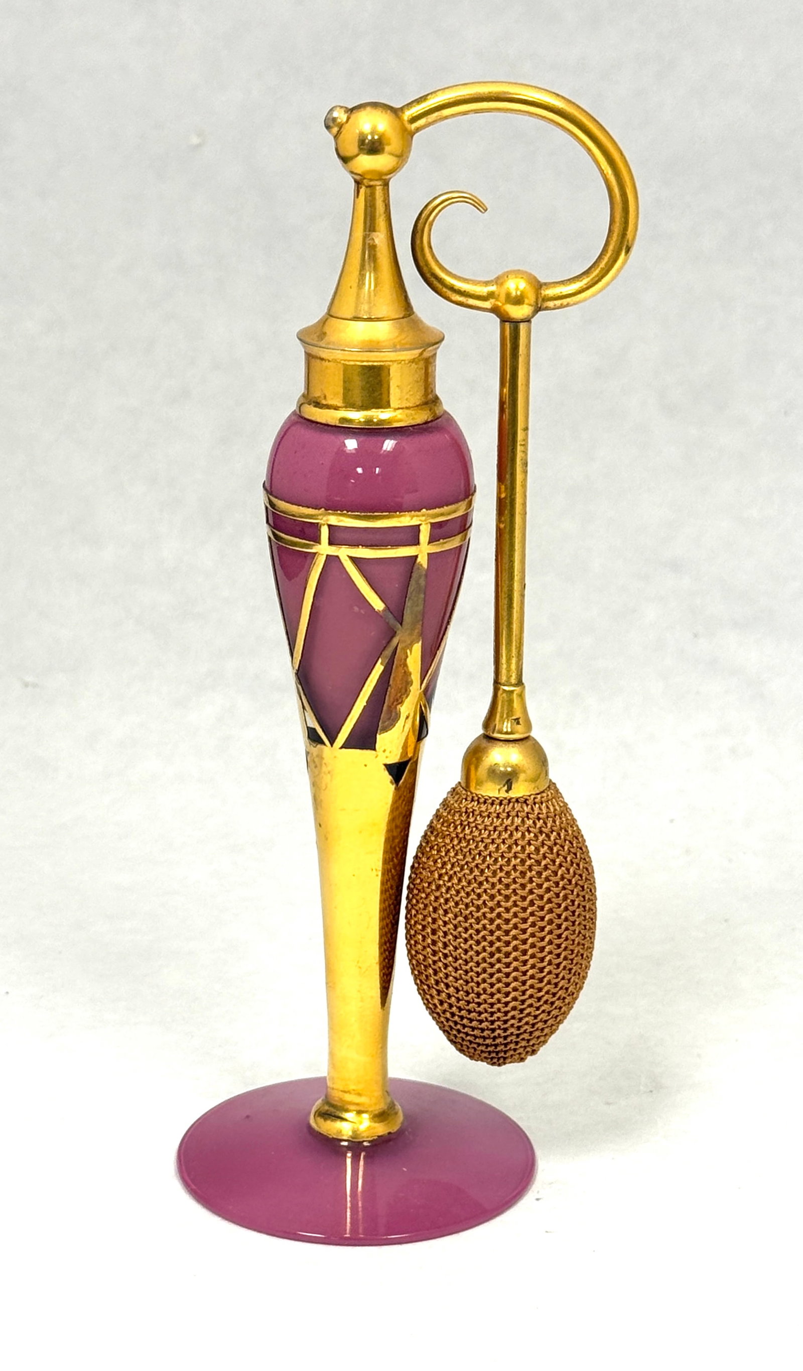 DeVilbiss Elegant Rose Perfume: DeVilbiss Elegant Line dusty rose perfume atomizer decorated with an Art Deco gold metal design, 7 1/2" ht. CONDITION: no chips, cracks, repairs, or material defects found, Jaremos attempts to call