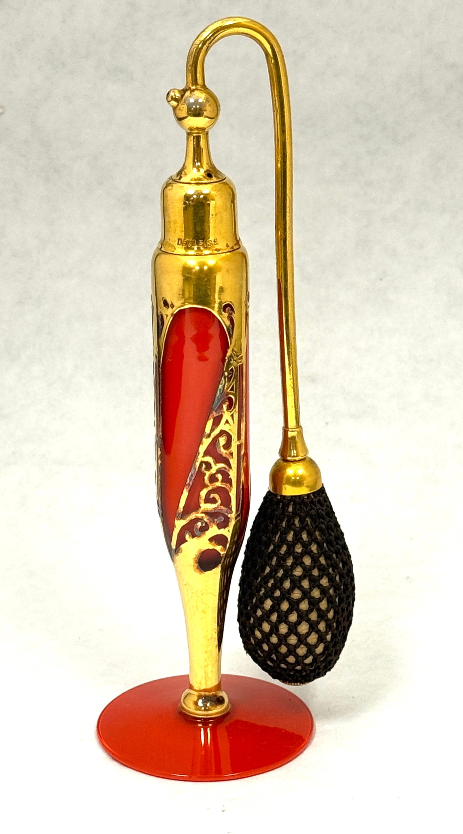 DeVilbiss Elegant Red Perfume: DeVilbiss Elegant Line red perfume atomizer decorated with an Art Deco gold metal design, 7 1/2" ht. CONDITION: no chips, cracks, repairs, or material defects found, Jaremos attempts to call any