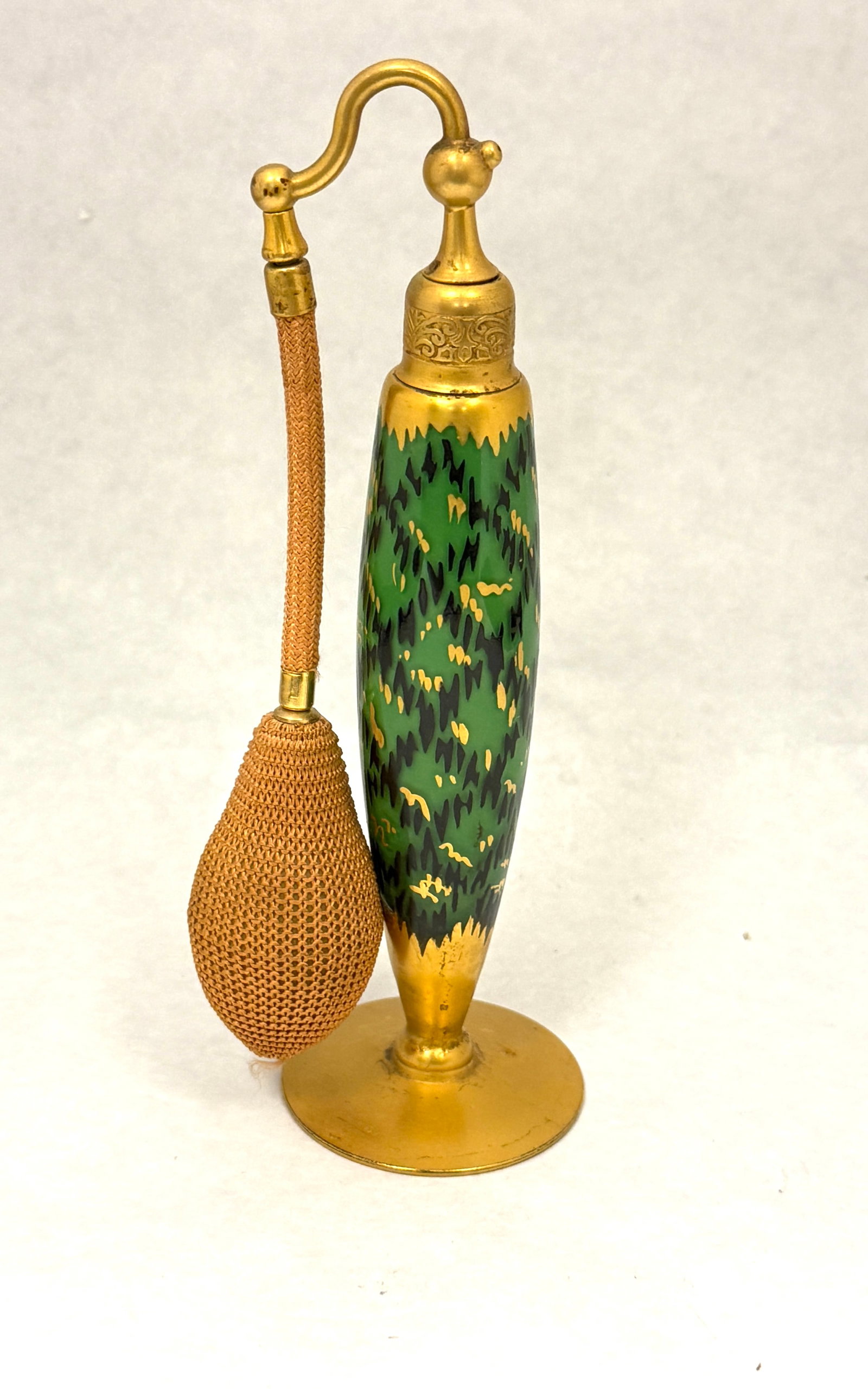 DeVilbiss Green Perfume: DeVilbiss green perfume decorated with a gold and black criss cross pattern, signed DeVilbiss, 7 1/2" ht. CONDITION: no chips, cracks, repairs, or material defects found, Jaremos attempts to call any