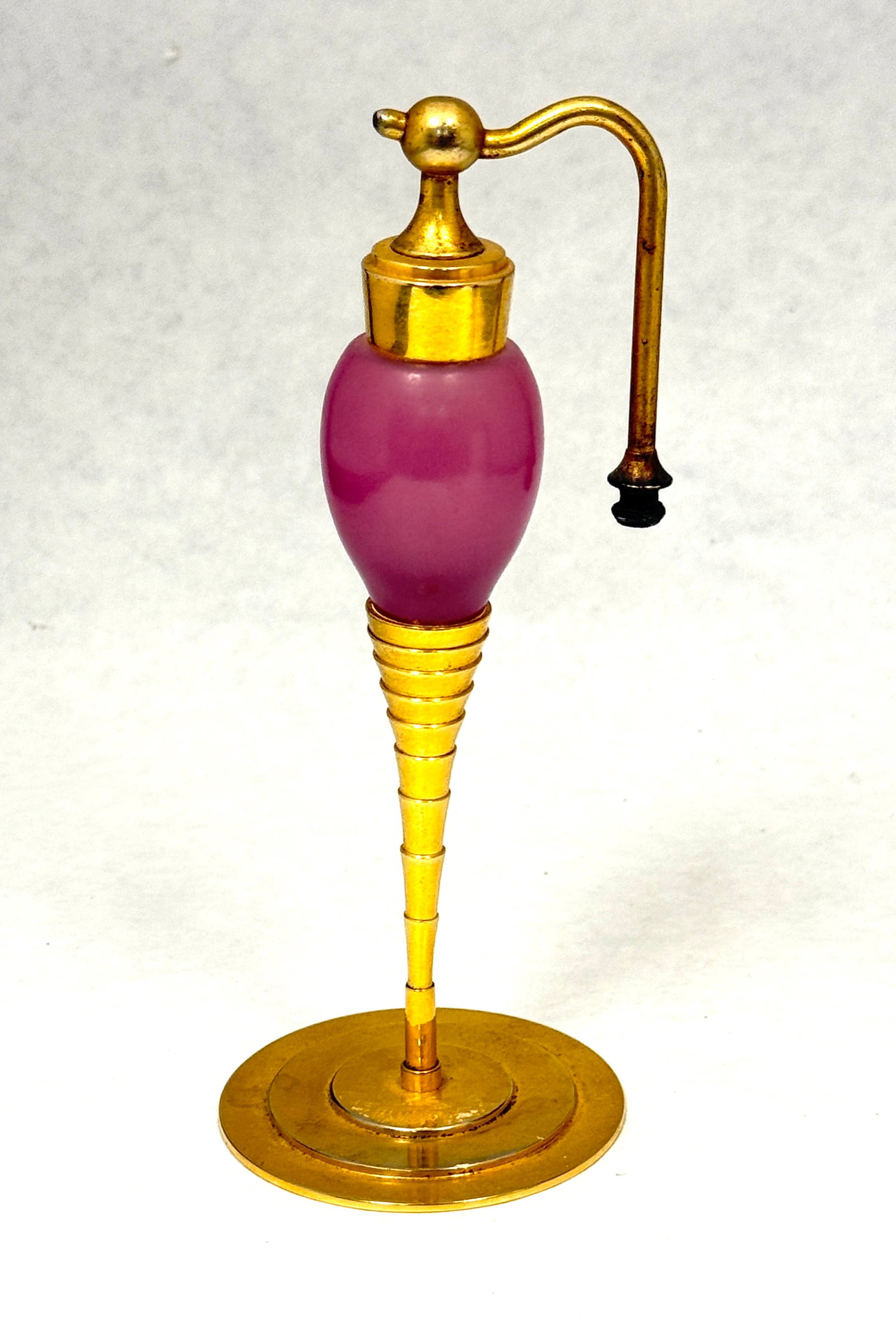 DeVilbiss Dusty Rose Perfume: DeVilbiss Dusty Rose Perfume with gold metal foot, 6 1/2" ht. CONDITION: no chips, cracks, repairs, or material defects found, Jaremos attempts to call any material flaw that affects the price, but