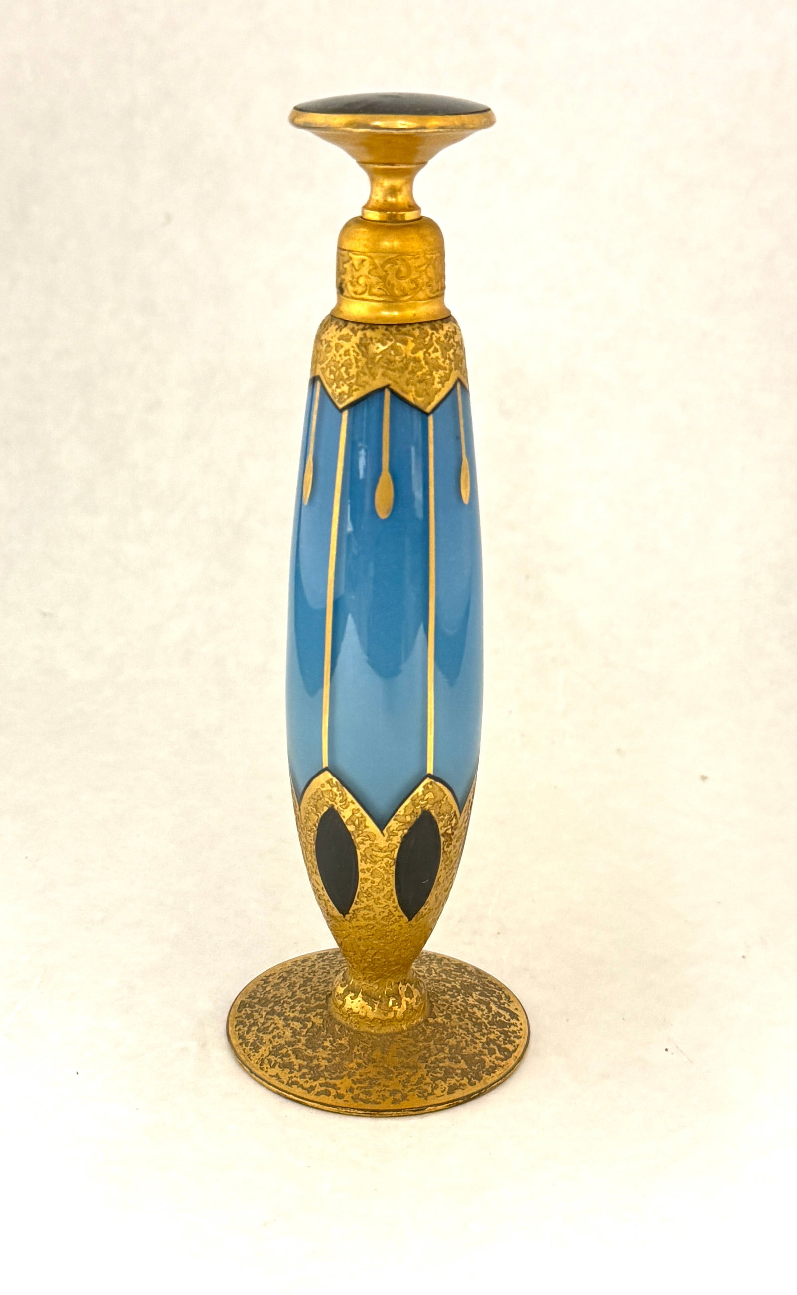 DeVilbiss Blue Perfume: DeVilbiss blue perfume bottle with gold overshot and a black tipped stopper, signed DeVilbiss 7" ht. CONDITION: no chips, cracks, repairs, or material defects found, Jaremos attempts to call any