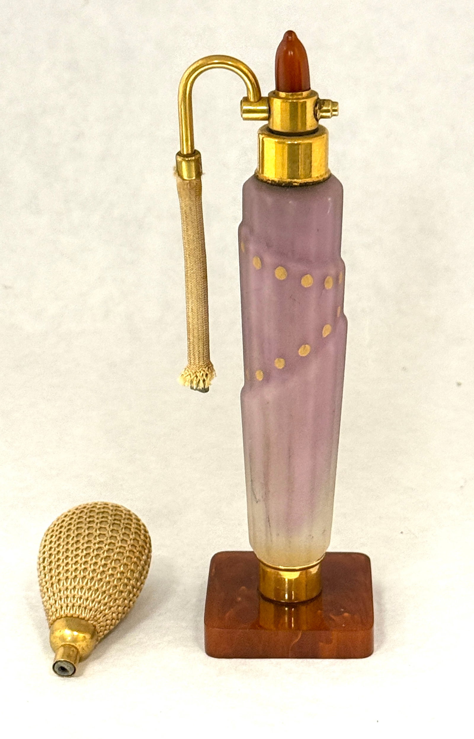 DeVilbiss Sky Scraper Perfume: Rare DeVilbiss Sky Scraper Perfume atomizer in purple with a Bakelite base, CONDITION: no chips, cracks, repairs, or material defects found, Jaremos attempts to call any material flaw that affects