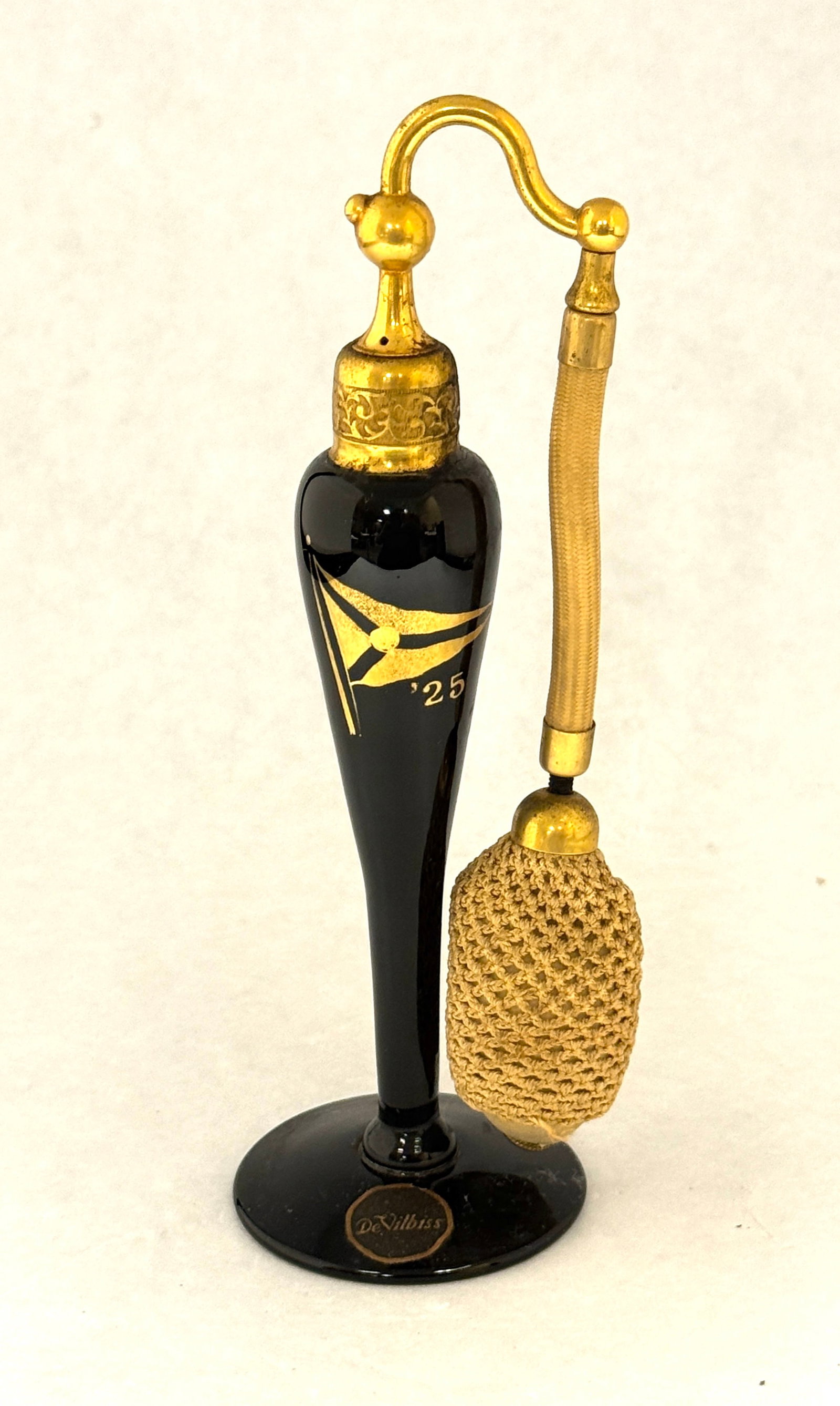 DeVilbiss Black Perfume: DeVilbiss Black Perfume decorated with a flag 25, signed DeVilbiss and carries a paper label, 7" ht. NOTE: Toledo Yacht club special order. CONDITION: no chips, cracks, repairs, or material defects