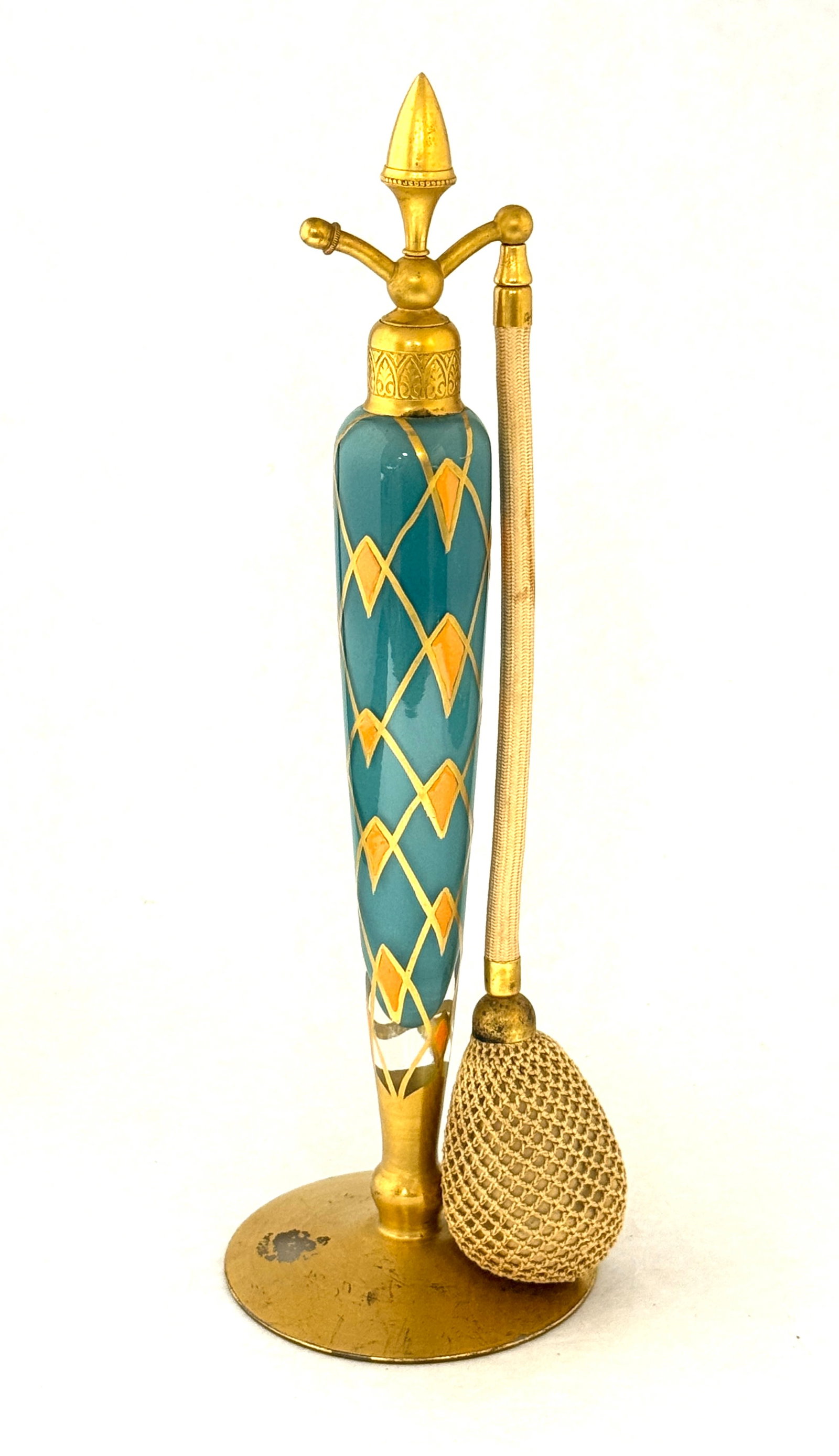 DeVilbiss Green Perfume: DeVilbiss elongated green perfume decorated in green with orange triangles, signed DeVilbiss, 10" ht. CONDITION: some paint loss, no chips, cracks, repairs, or material defects found, Jaremos