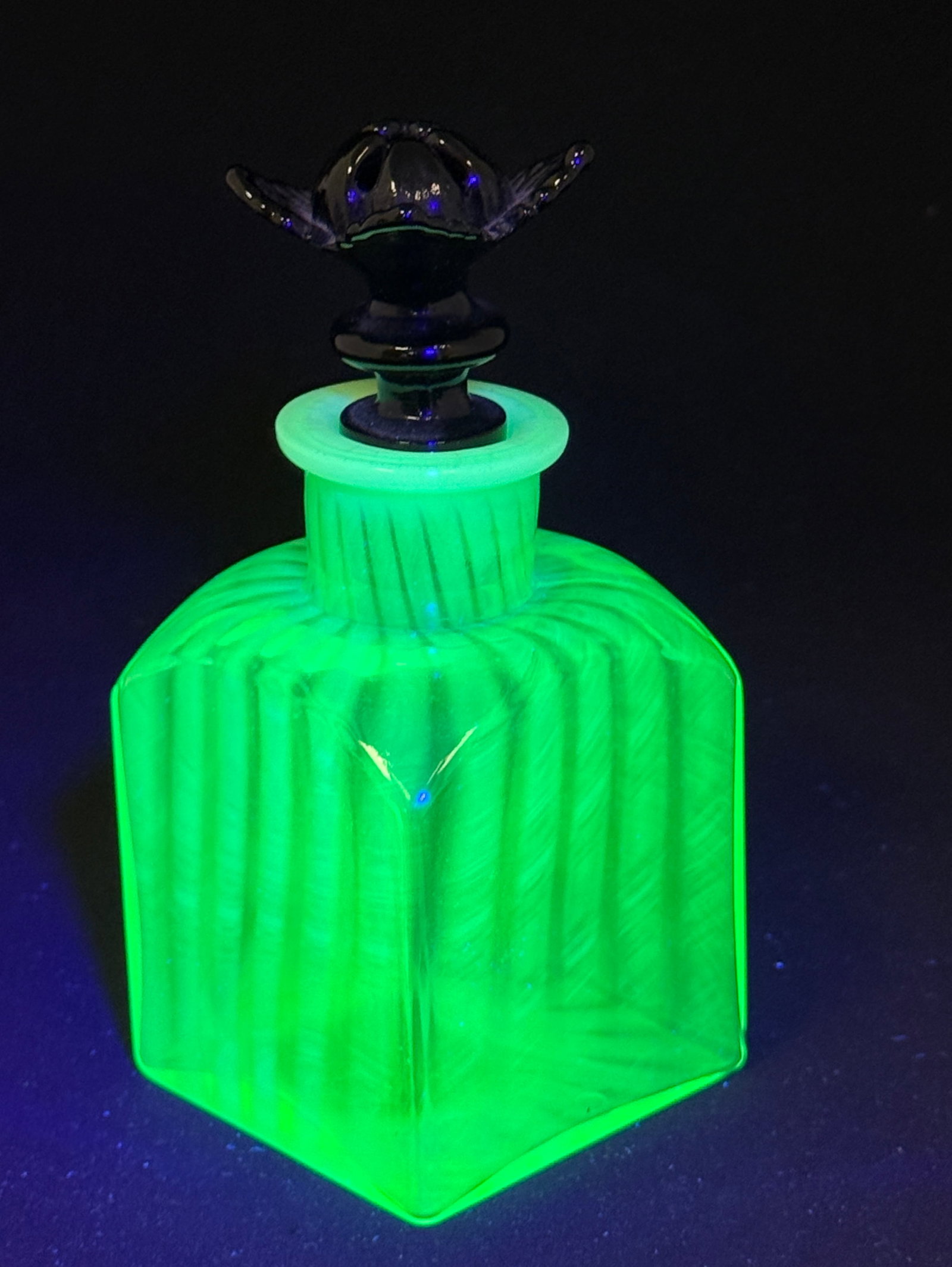 Fenton Vaseline Cologne: Fenton uranium vaseline cologne in lime fitted with a black flower stopper, 5 1/2" ht. CONDITION: no chips, cracks, repairs, or material defects found, Jaremos attempts to call any material flaw that