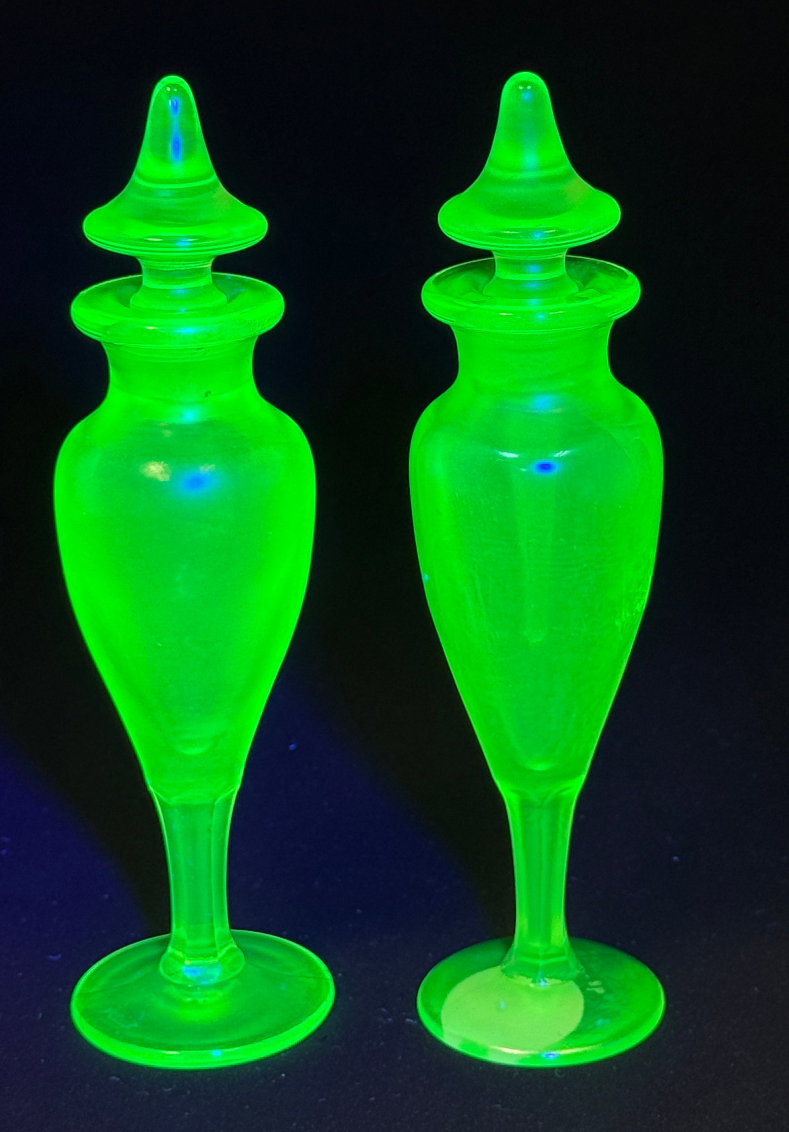 2 Fenton Vaseline Perfumes: 2 Fenton vaseline perfumes, 7" ht. PROVENANCE: from the collection of Ferill and Otis Rice founders of the FAGCA, Frank Fenton Museum Randy Clark Auction. CONDITION: no chips, cracks, repairs, or