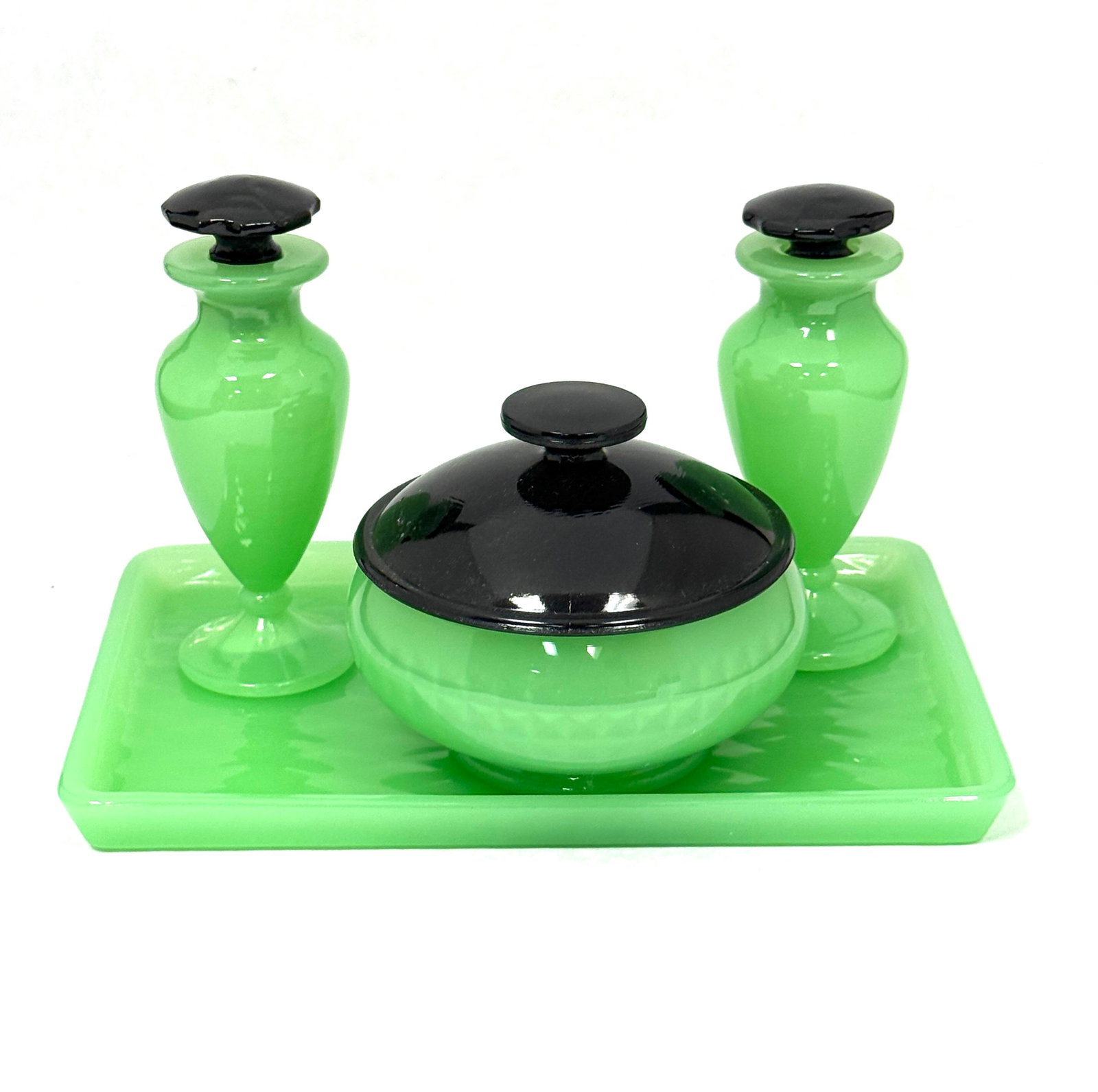 Fenton Jade Bath Set: Fenton Jade bath set with two perfumes, a tray and a covered jar, lid in mirror black, 8 1/2" long. CONDITION: no chips, cracks, repairs, or material defects found, Jaremos attempts to call any