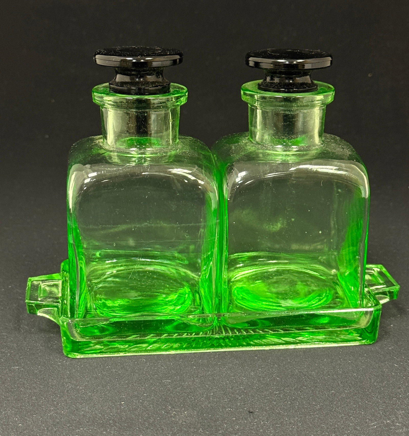 Cambridge Vaseline Bath Set: Cambridge vaseline bath set including two bottles and a tray, 5 1/2" long. CONDITION: no chips, cracks, repairs, or material defects found, Jaremos attempts to call any material flaw that affects the