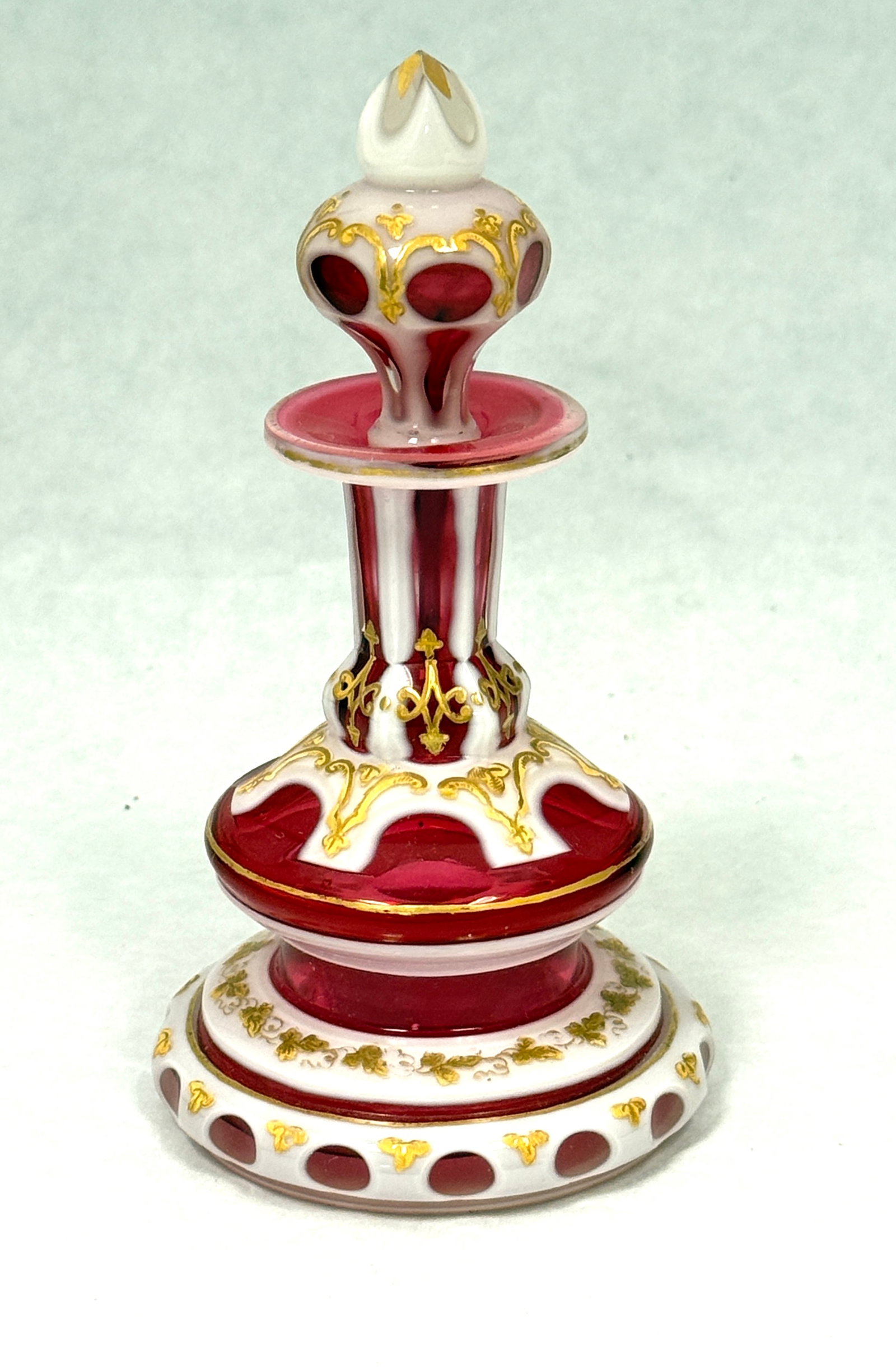 Bohemian Opal Cut to Cranberry: Bohemian opal cut to cranberry perfume decorated with enameled flowers, 5 1/2" ht. CONDITION: no chips, cracks, repairs, or material defects found, Jaremos attempts to call any material flaw that