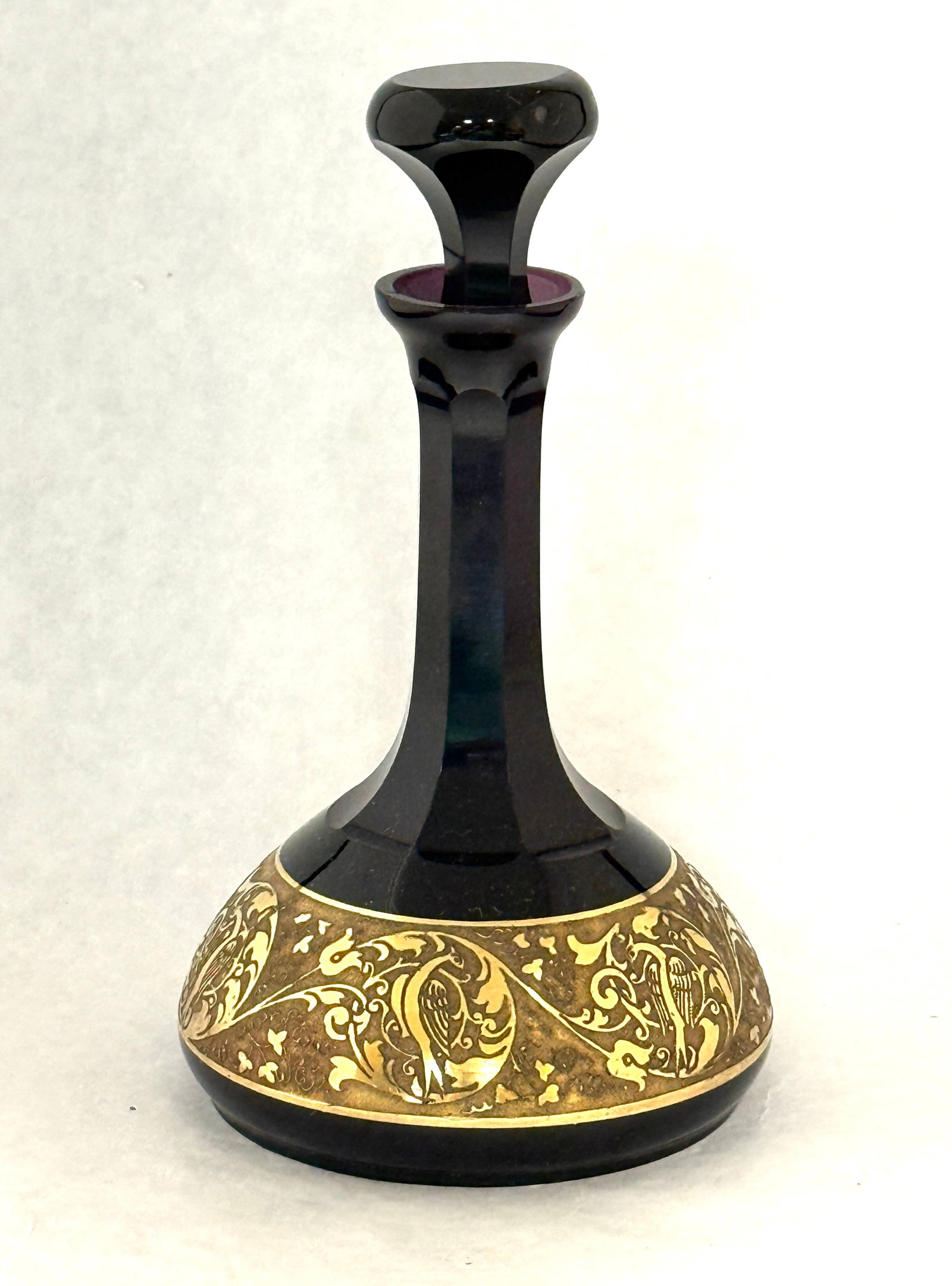 Moser Amethyst Perfume: Moser faceted purple perfume decorated with a gold band of flowers, 8" ht. CONDITION: no chips, cracks, repairs, or material defects found, Jaremos attempts to call any material flaw that affects the