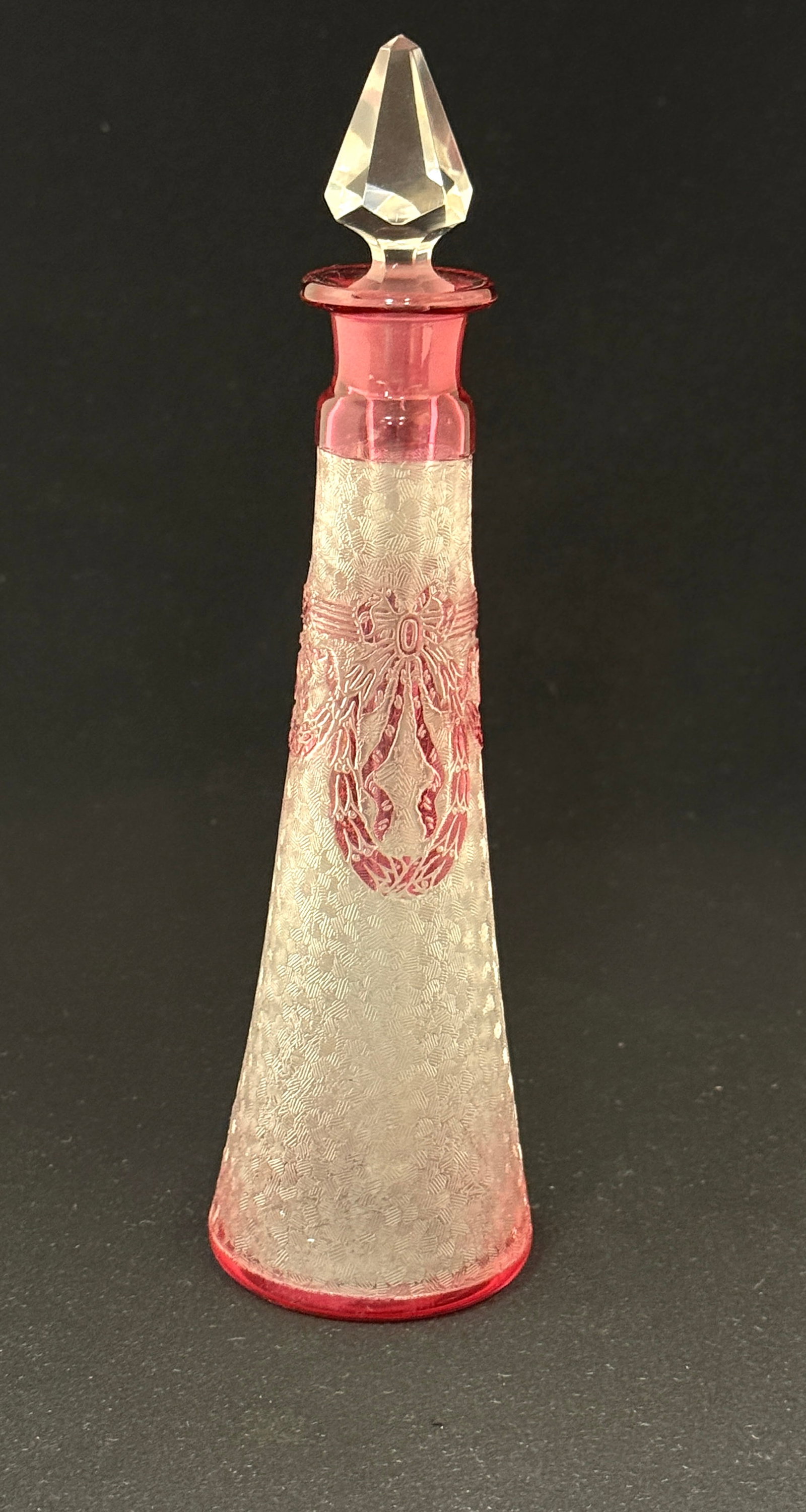 St Louis Needle Etched Perfume: St. Louie tee pee form needle etched translucent perfume decorated with a cranberry cameo ribbon, 8" ht. CONDITION: no chips, cracks, repairs, or material defects found, Jaremos attempts to call any