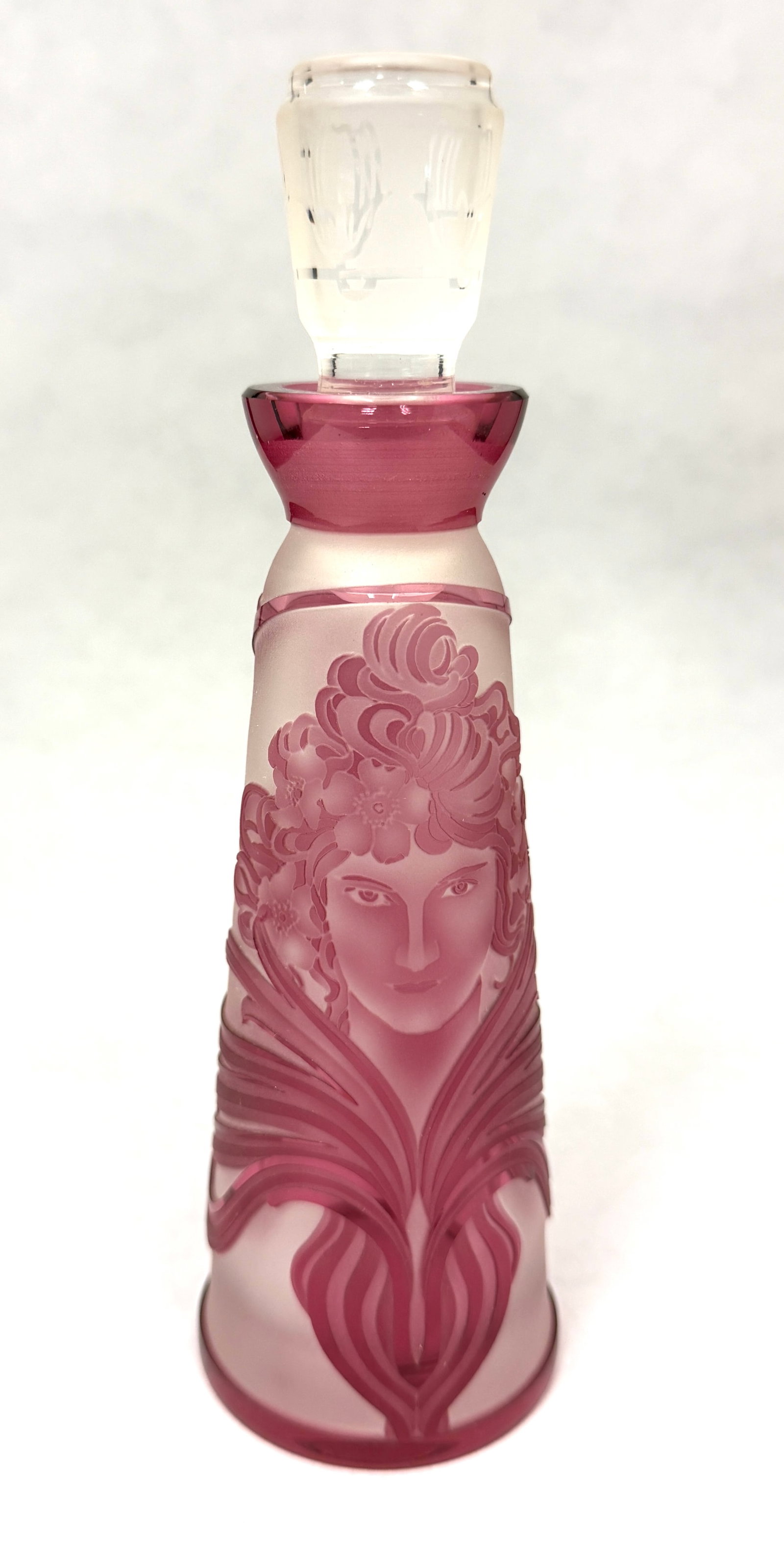 French Cameo Perfume Bottle: French Cameo perfume bottle in translucent glass decorated with a cameo and Art Nouveau Face, highlighted with a cameo stopper, attributed to Val St. Lambert, 7 1/2" ht. CONDITION: no chips, cracks,