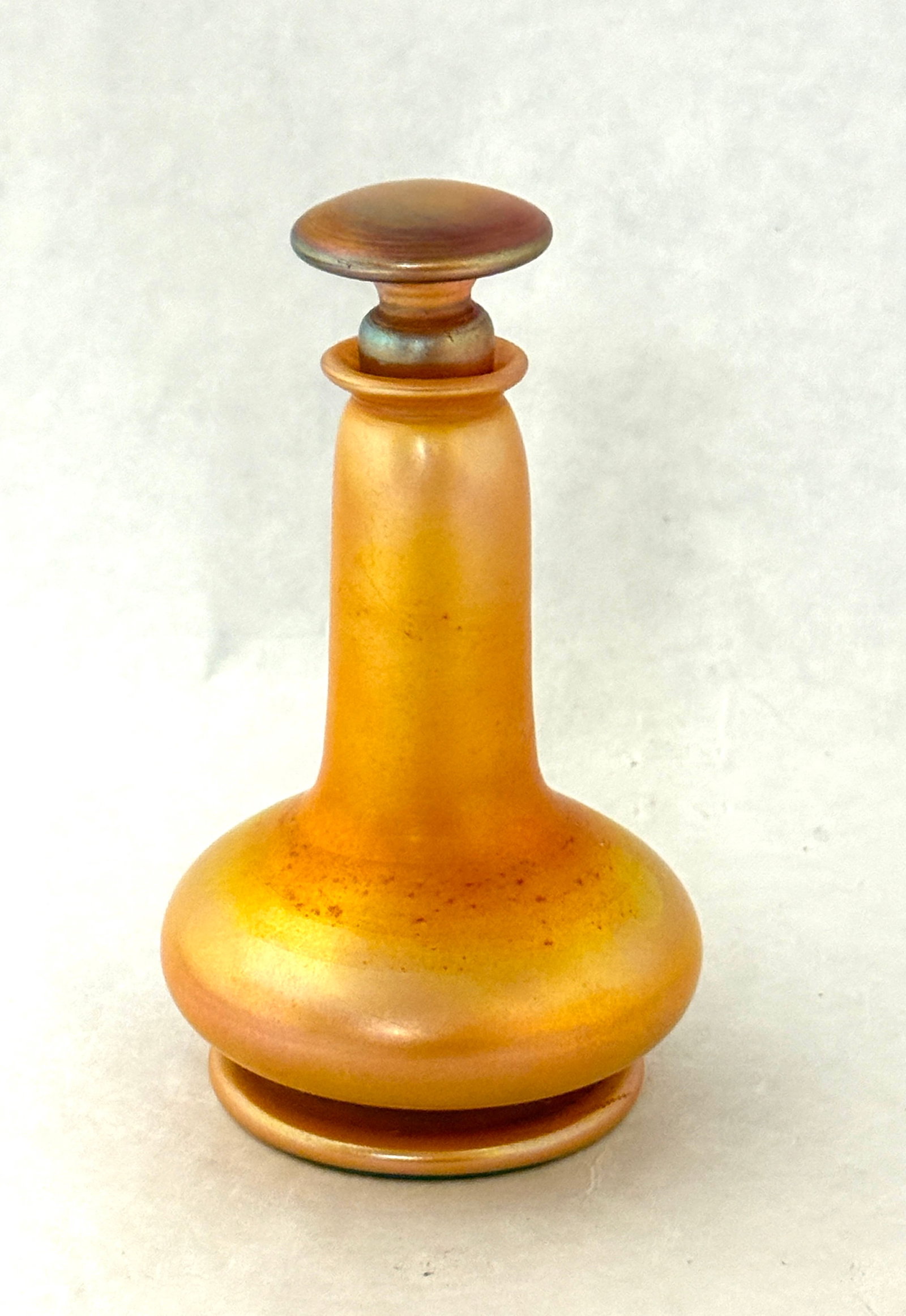 Quezal Iridescent Gold Perfume: Quezal iridescent gold perfume signed Quezal, 5" ht. CONDITION: no chips, cracks, repairs, or material defects found, Jaremos attempts to call any material flaw that affects the price, but minor