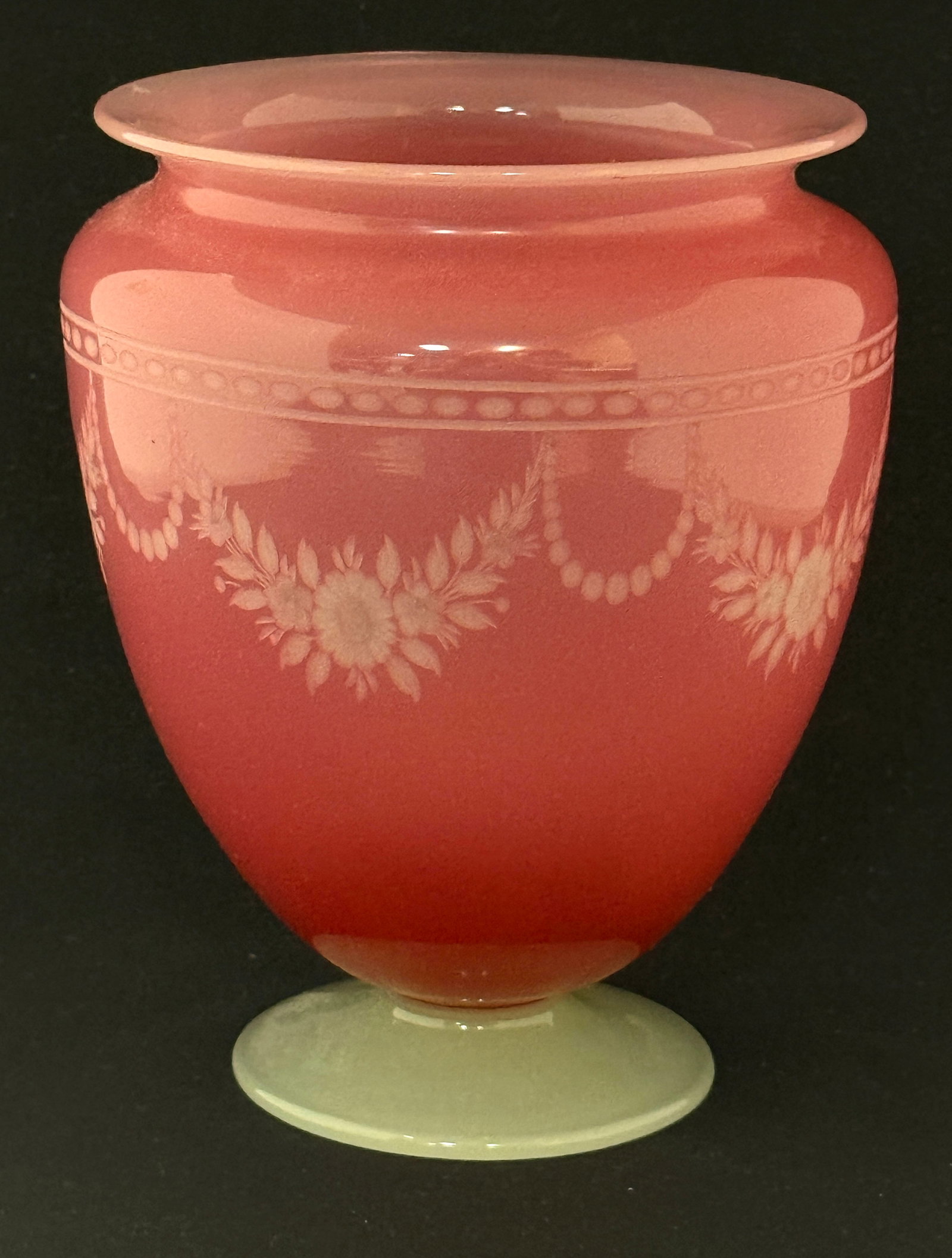 Steuben Rosaline Vase: Steuben classic form Rosaline shouldered vase with an opal foot cut with a band of swag flowers in the York pattern, 7" ht. CONDITION: no chips, cracks, repairs or material defects found, Jaremos