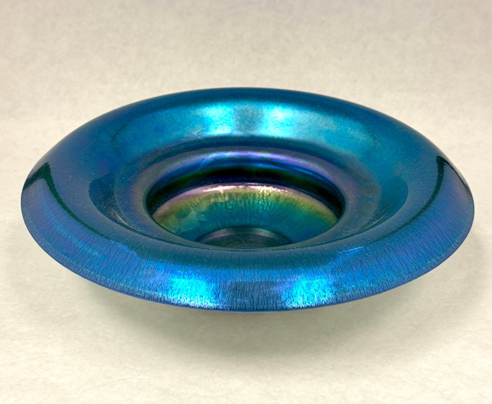 Steuben Blue Calcite Center bowl: Steuben Blue Aurene over Calcite double bulbous center bowl with original paper label, 10 1/2" wide. CONDITION: no chips, cracks, repairs or material defects found, Jaremos attempts to call any