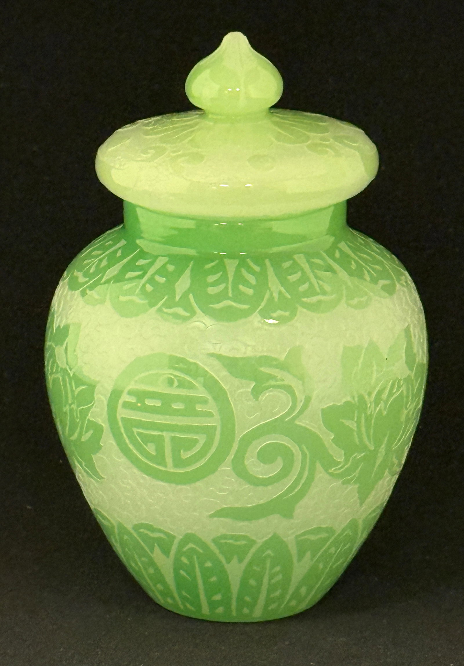 Steuben ACB covered jar: Steuben acid cut back covered temple jar in a green oriental design over a double ACB scrolling back ground, 6 1/2" ht. CONDITION: no chips, cracks, repairs or material defects found, Jaremos