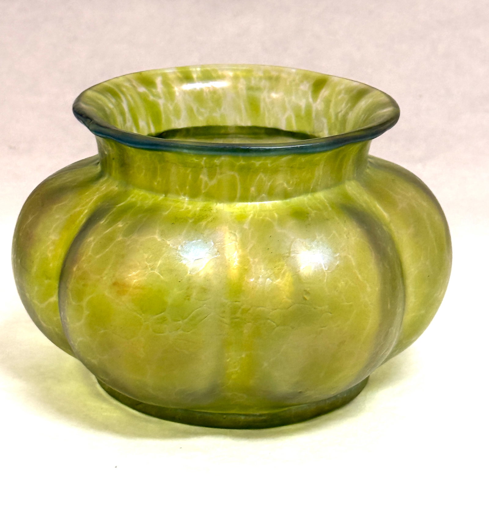 Loetz Green Oil Finish Vase: Loetz oil finish green melon ribbed squat vase; ht. 4 1/2". CONDITION: no chips, cracks, repairs, or material defects found, Jaremos attempts to call any material flaw that affects the price, but