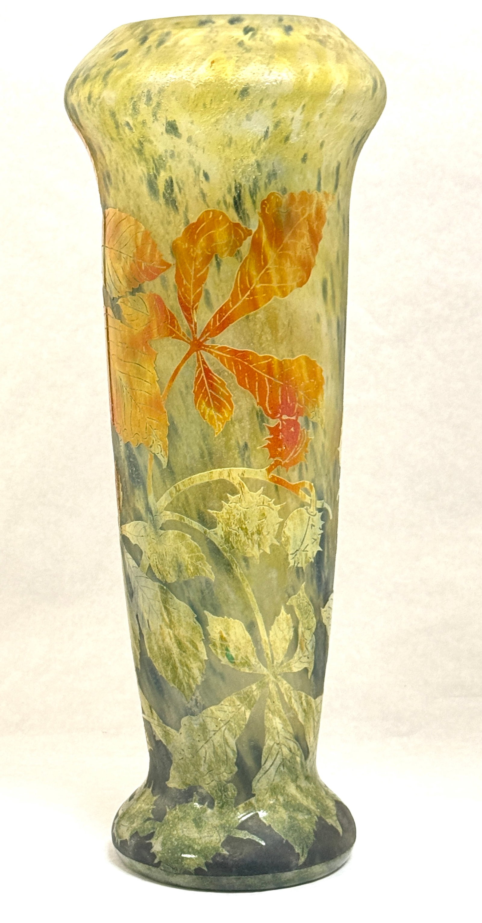 Large Daum Cameo Vase: Large mottled yellow and blue cameo vase decorated with orange and green sweet gum leafing branch, signed in cameo Daum Nancy; ht. 19". CONDITION: no chips, cracks, repairs or material defects found,