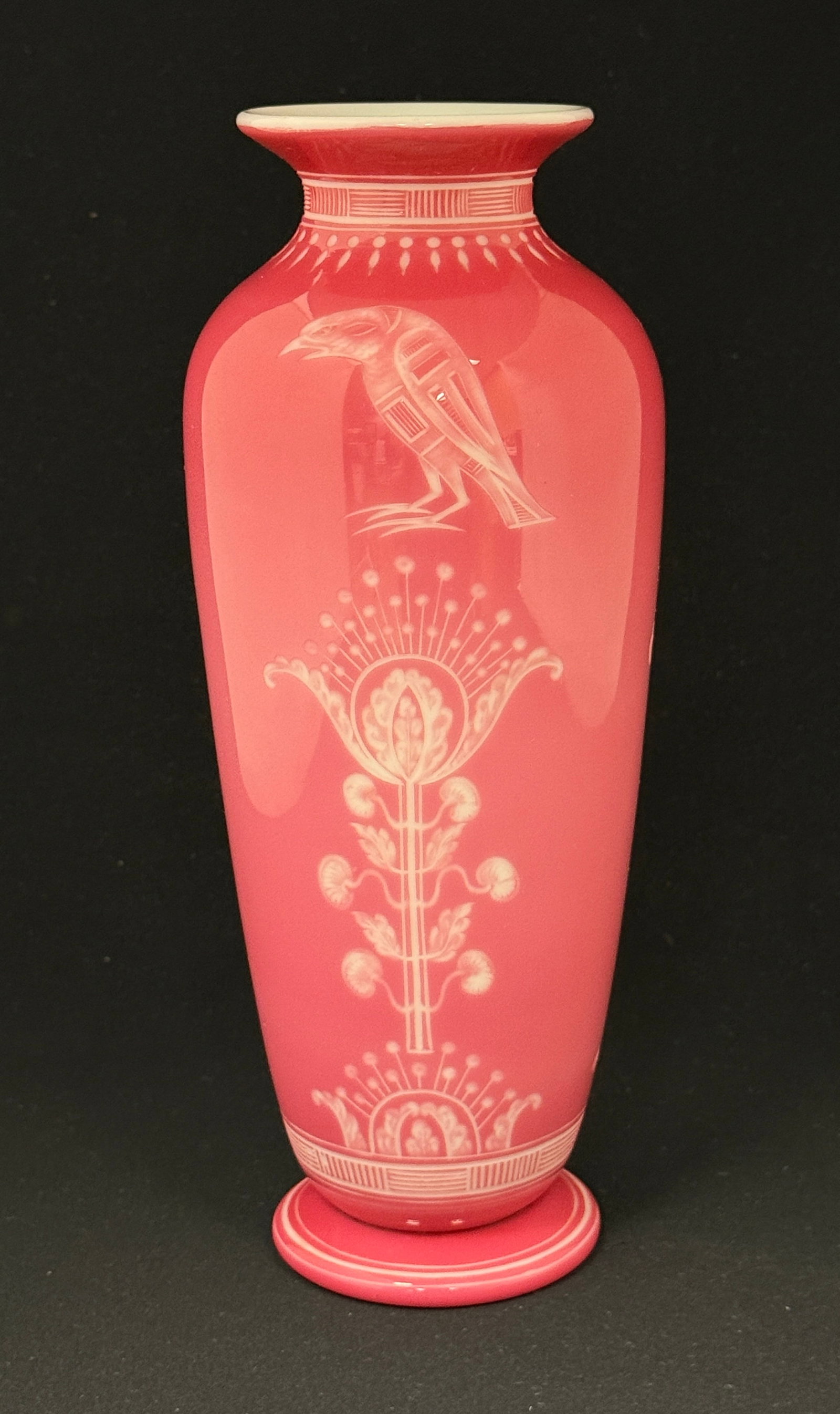 Stevens and Williams Vase: Stevens and Williams classic form Rosaline glass vase decorated with a cut Egyptian design of Horus the bird god over a scrolling flower, 9 1/2" ht. PROVENANCE: Woodys Auction. CONDITION: no chips, cr