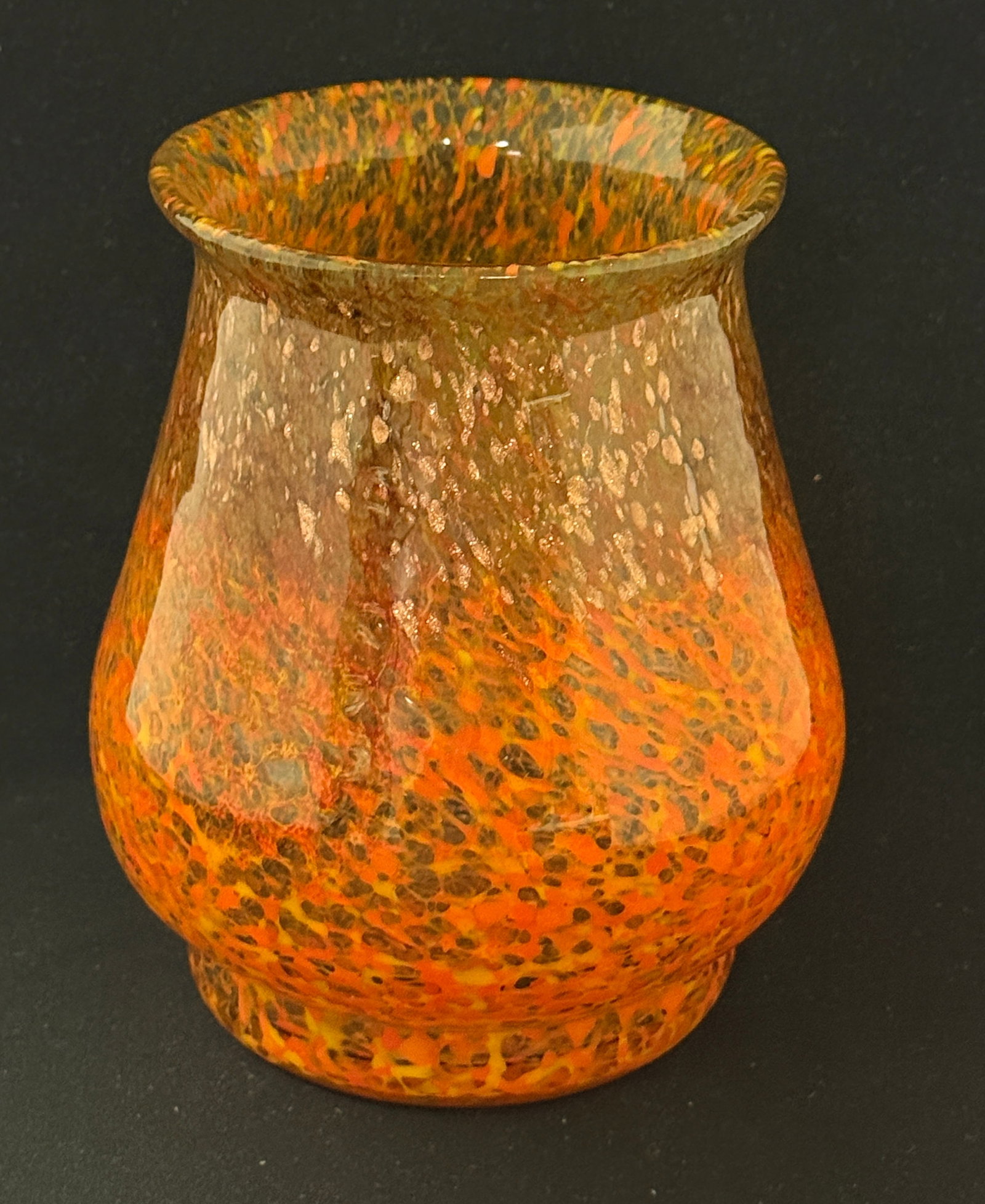 Monart Art Glass Vase: Monart art glass vase in orange graduating to brown with overall gold aventurine, 7 1/4" ht. CONDITION: no chips, cracks, repairs or material defects found, Jaremos attempts to call any material flaw 