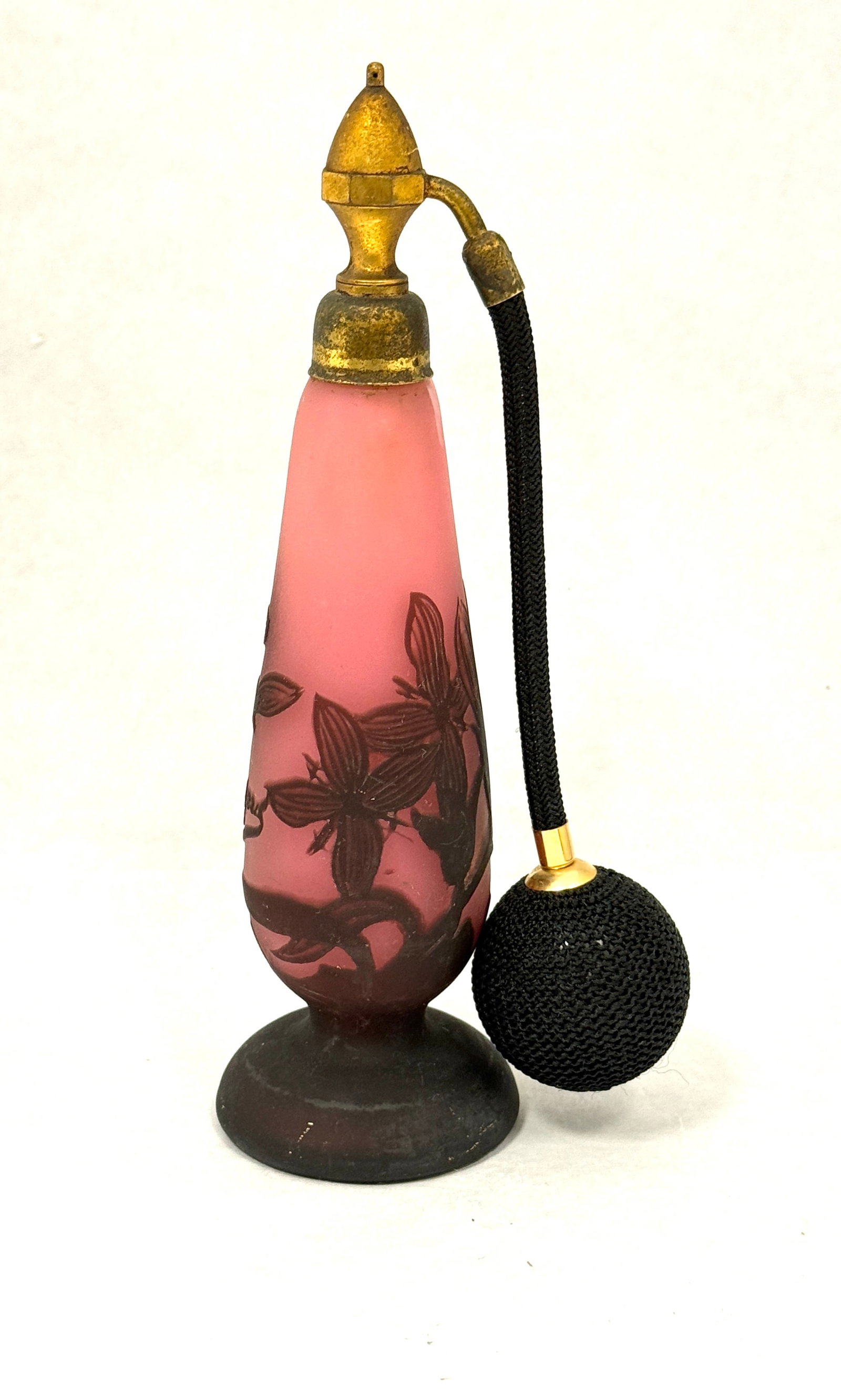 Richard Cameo Perfume Bottle: Richard pink cameo perfume bottle decorated with flowers, signed in cameo Richard, 8" ht. CONDITION: no chips, cracks, repairs or material defects found, Jaremos attempts to call any material flaw