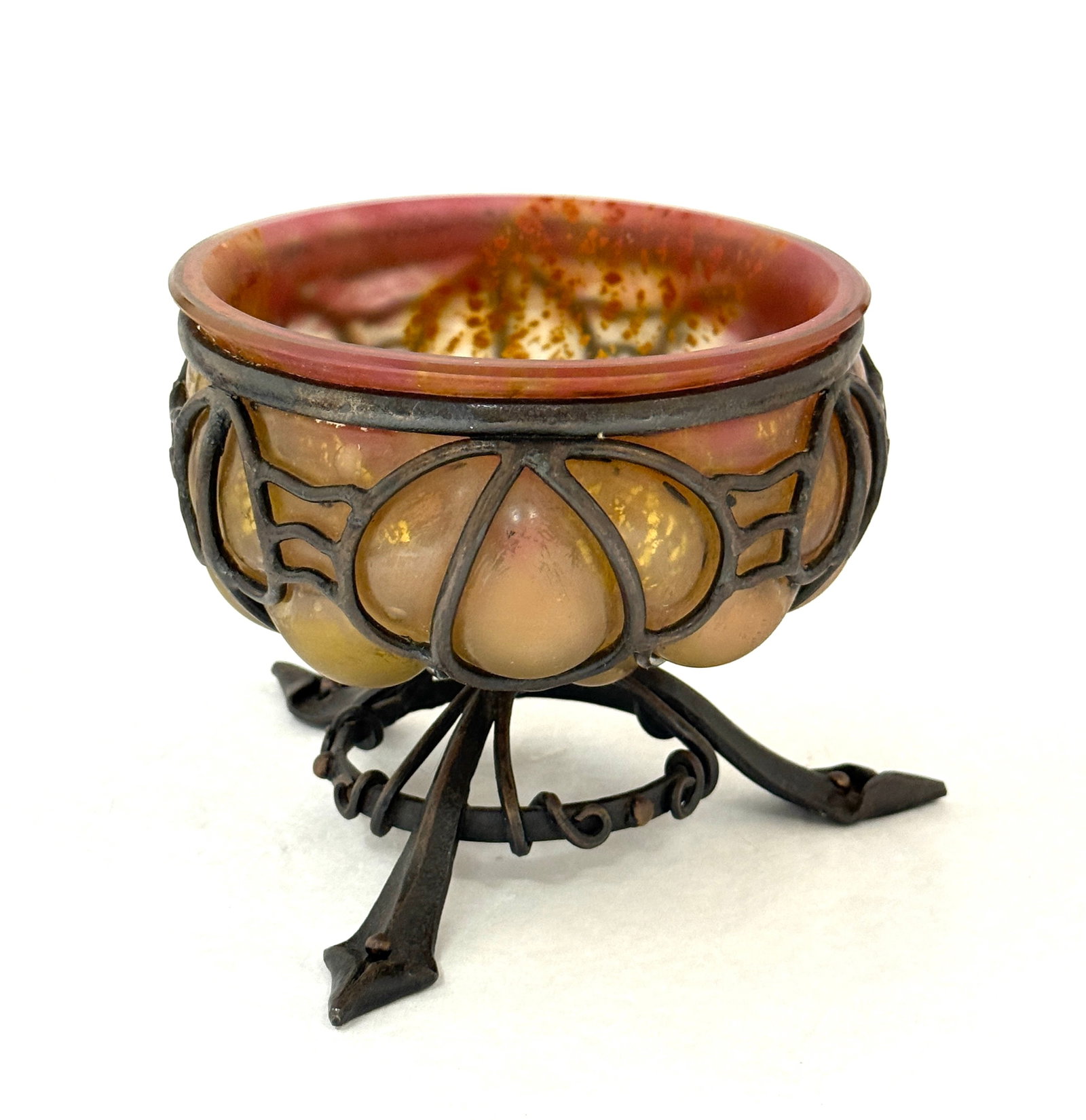 Daum/Marjorelle Vase: Daum/Marjorelle iron frame with a blown in Daum bowl in orange glass with gold aventurine, signed both artist; diatmeter 5 1/4". CONDITION: no chips, cracks, repairs or material defects found,