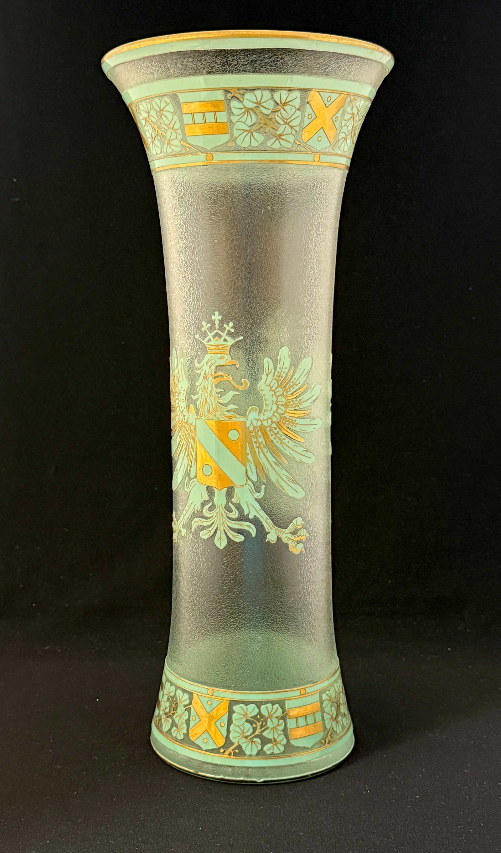 Tall Baccarat Cameo Vase: Tall Baccarat cameo vase, textured background with green and gold eagle and top and bottom banding with flowers and shields; 15 3/4" ht. CONDITION: roughness to bottom rim see picture, no cracks, repa