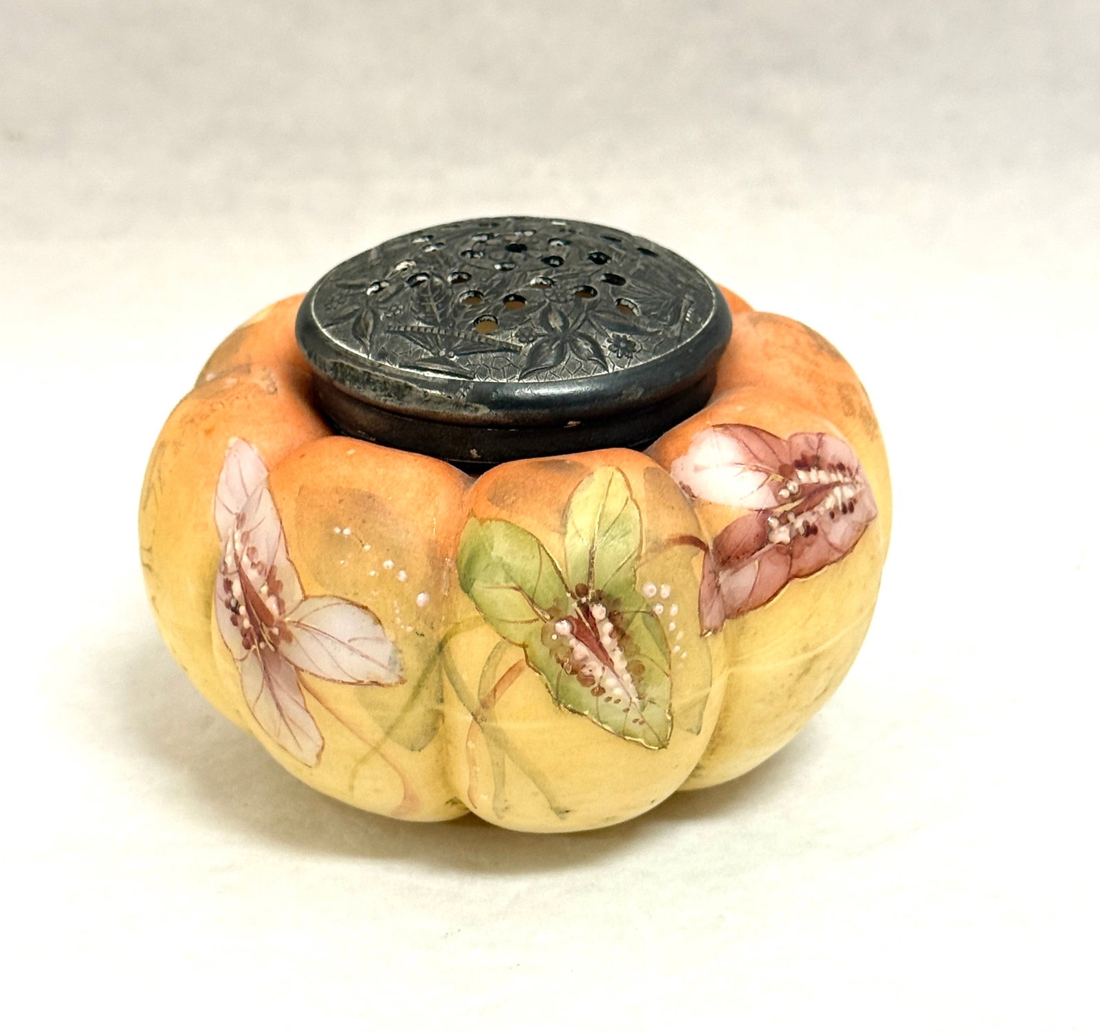 Two Mt. Washington Sugars: Two Mt. Washington melon sugar shakers with enameled flowers, 4" wide. CONDITION: no chips, cracks, repairs or material defects found, Jaremos attempts to call any material flaw that affects the