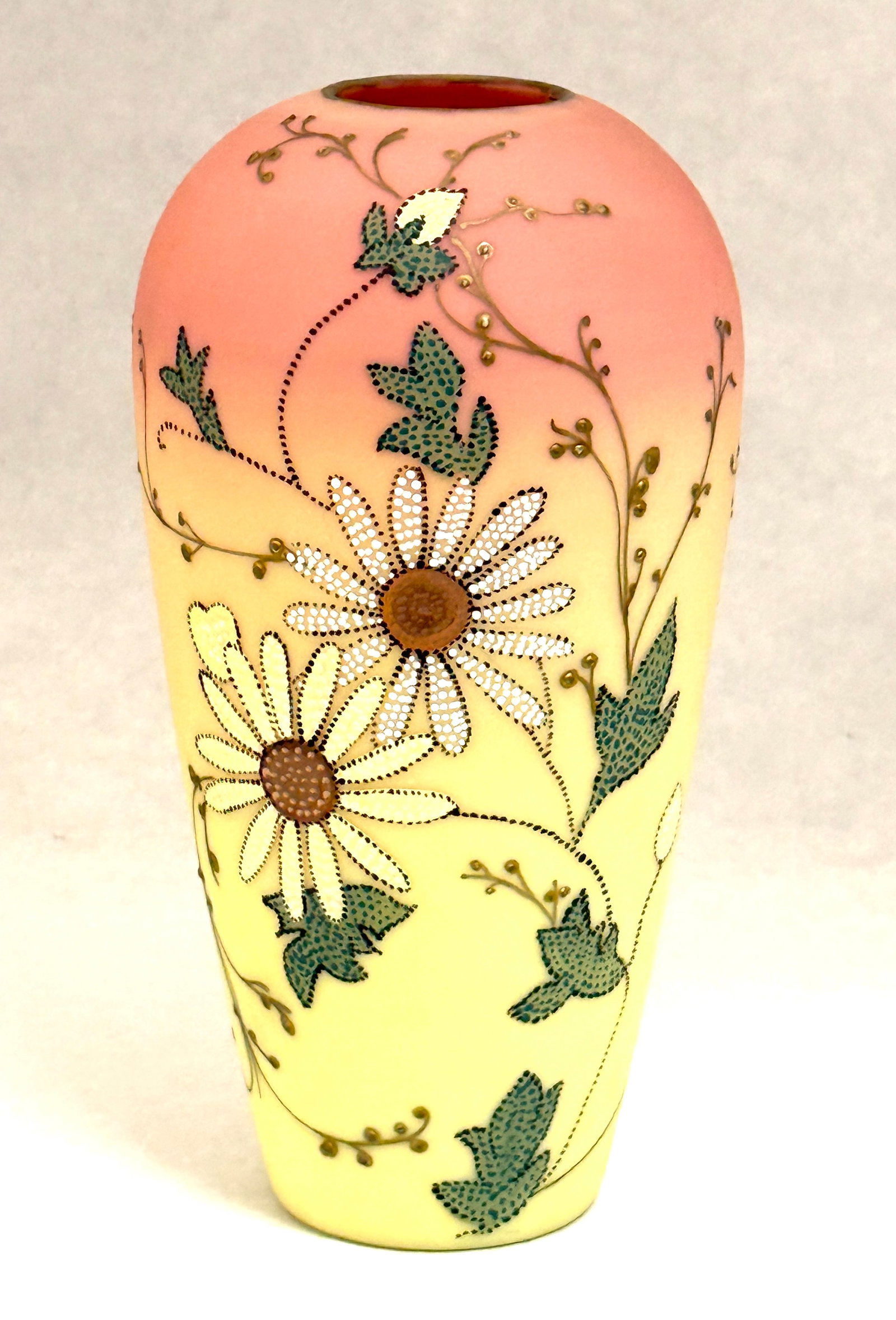 Mt. Washington Burmese Vase: Mt. Washington cylindrical Burmese glass vase decorated with the Queens pattern in a pointillism style, 9 1/2" ht. CONDITION: slight overpainting no chips, cracks, repairs or material defects found, J