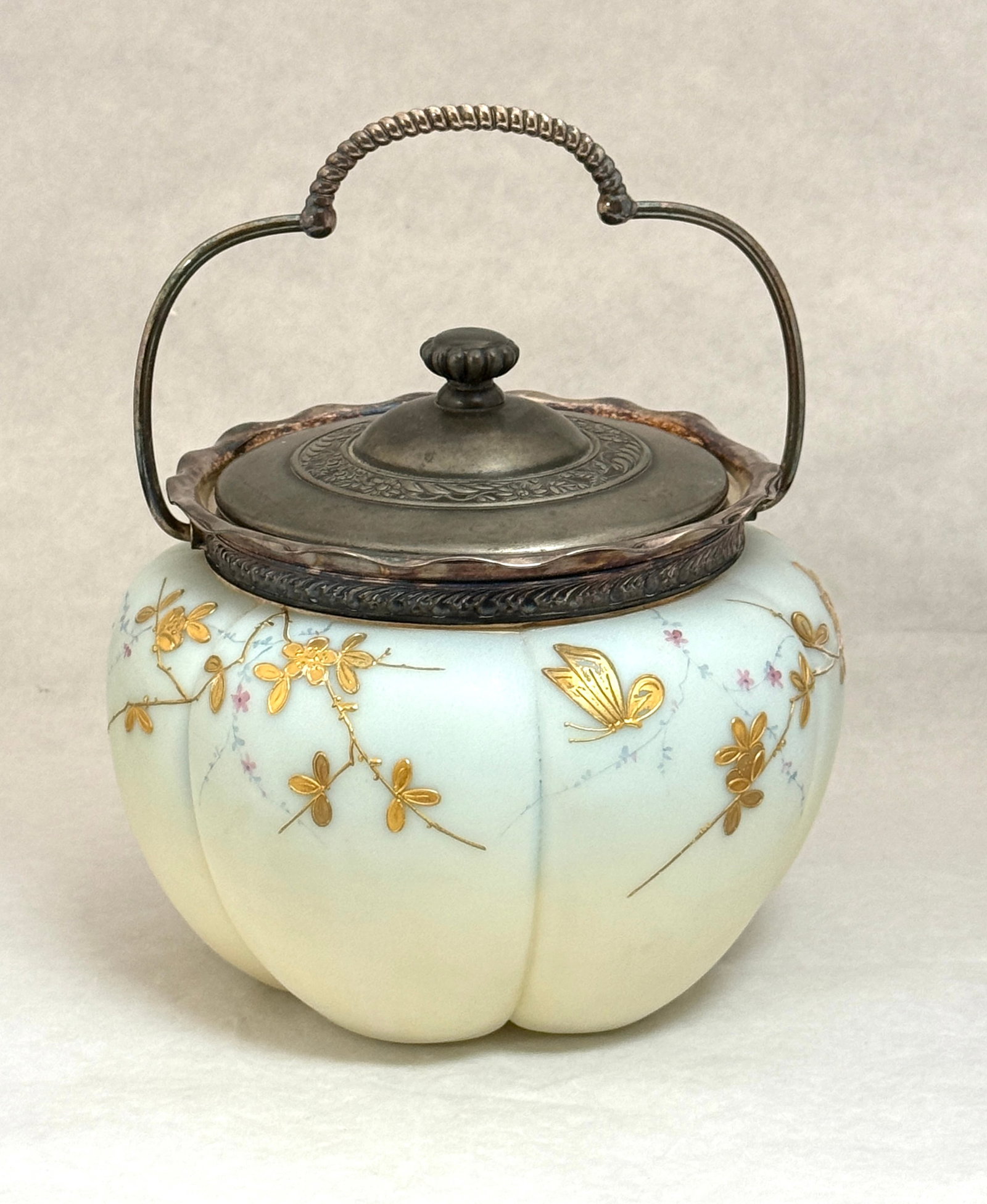 Mt Washington Cracker Jar: Mt. Washington blue melon cracker jar with gilt enameled flowers, lid signed MW, with handle 9" ht. CONDITION: no chips, cracks, repairs or material defects found, Jaremos attempts to call any