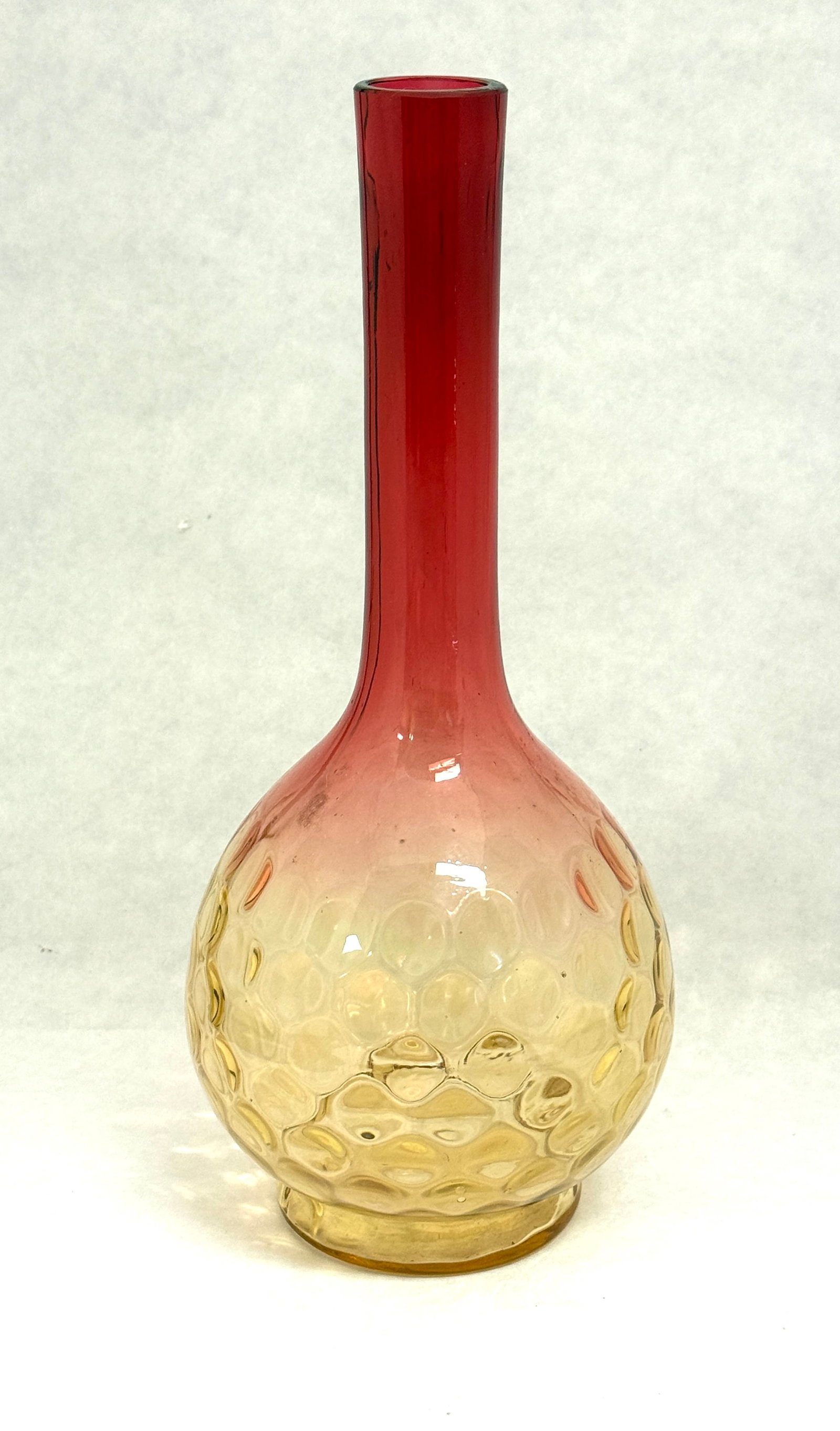 Amberina bulbous bottle: Amberina bulbous bottle in a honeycomb pattern, 10" ht. CONDITION: no chips, cracks, repairs or material defects found, Jaremos attempts to call any material flaw that affects the price, but minor