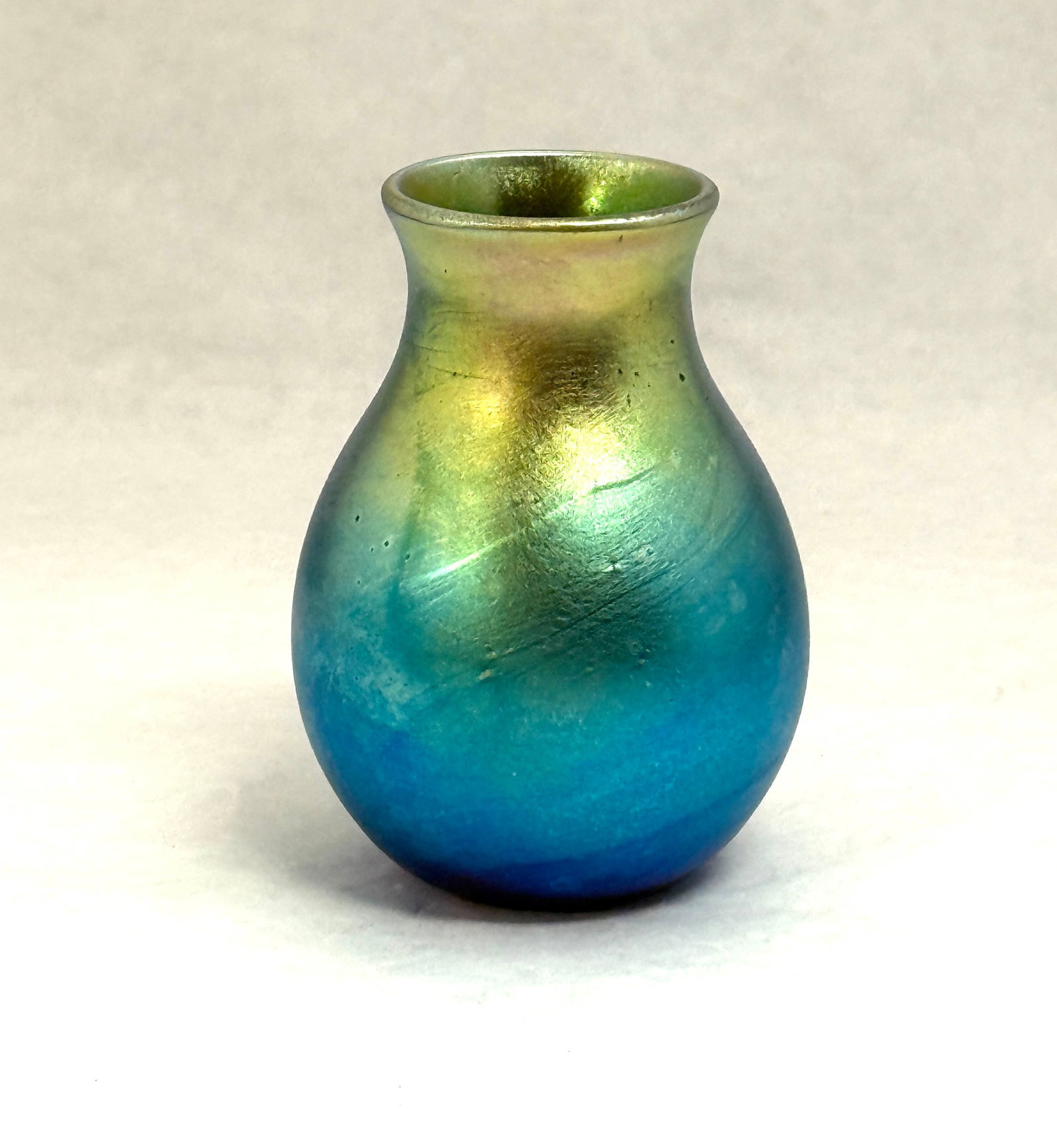 Charles Lotton Blue Iridized Vase: Charles Lotton blue iridized large cabinet vase, signed Charles Lotton 78; ht. 4". CONDITION: no chips, cracks, repairs or material defects found, Jaremos attempts to call any material flaw that