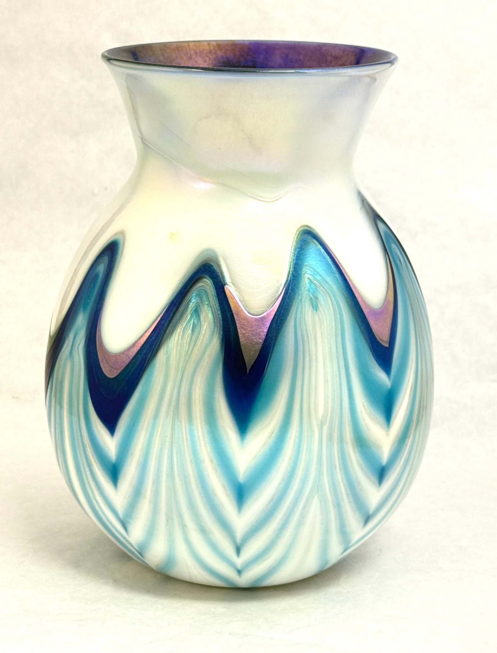 Charles Lotton Vase: Charles Lotton turquoise and purple tipped in blue pulled feather on opal, signed Lotton 1974; ht. 8 1/2". NOTE: Collection of Joan Allen Walker, an early collector of Lotton Glass and purchased