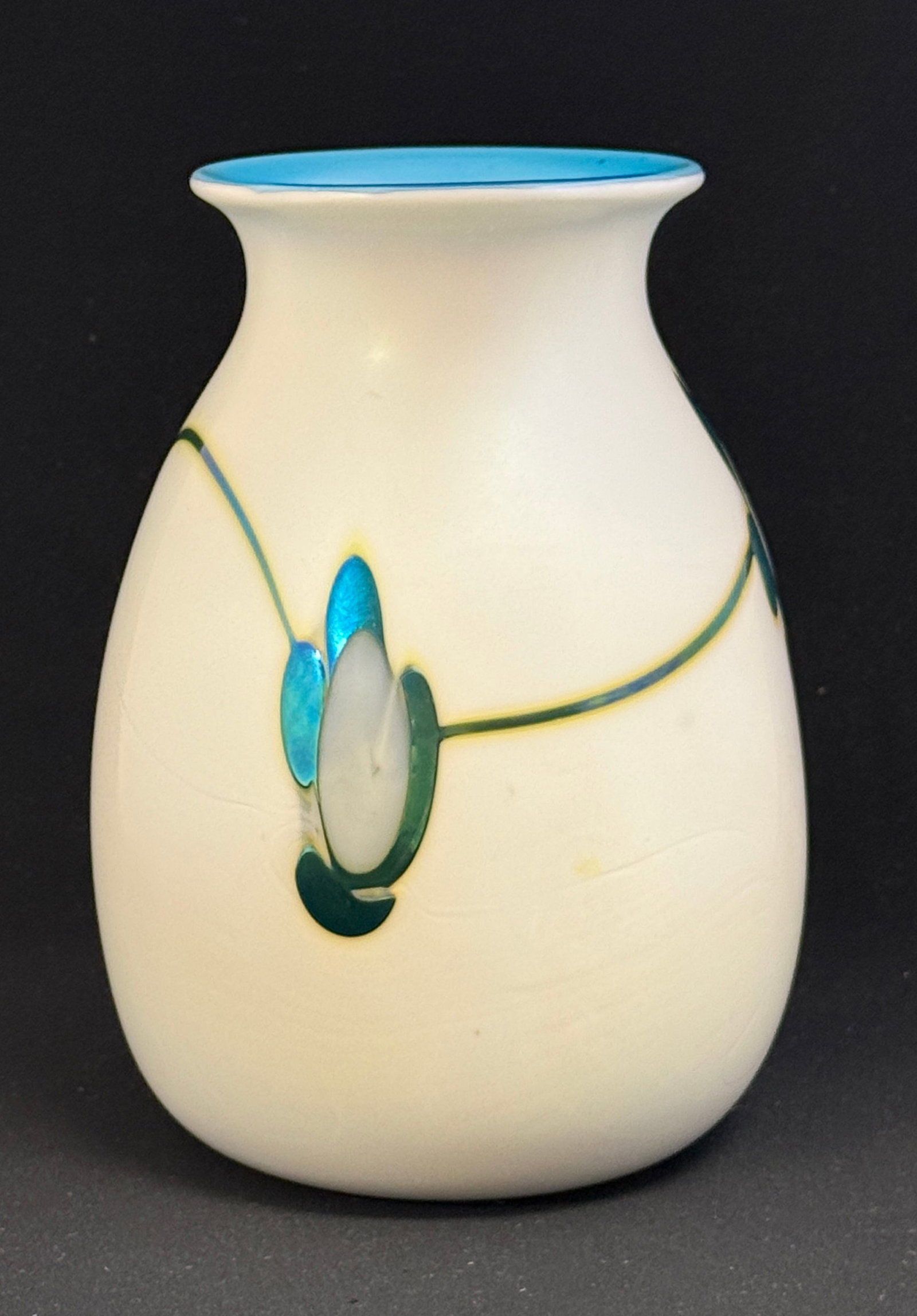 Charles Lotton Opal Vase: Charles Lotton opal vase with light blue interior and random blue and white iridized flowers, signed Lotton 1973; ht. 8 1/2". NOTE: Collection of Joan Allen Walker, an early collector of Lotton Glass