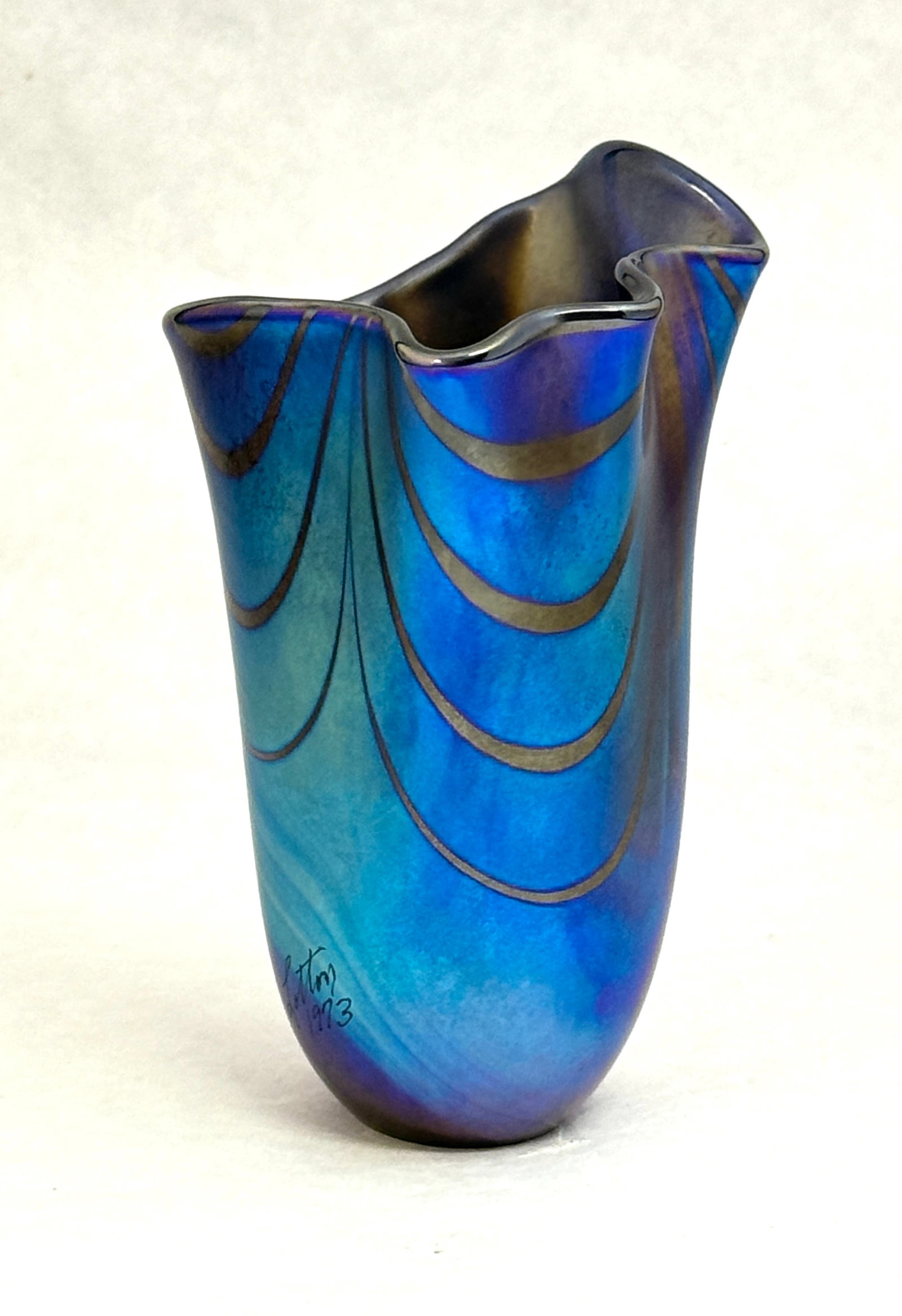 Charles Lotton Handkerchief Vase: Charles Lotton blue elongated handkerchief vase with a loop design, signed on the side Lotton 1973, 5" ht. NOTE: Collection of Joan Allen Walker, an early collector of Lotton Glass and purchased