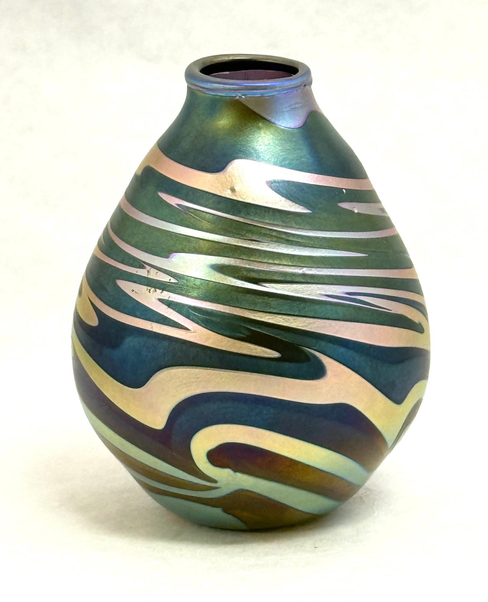 Charles Lotton Iridescent Vase: Charles Lotton iridescent purple vase with green hues decorated with an iridescent gold zig zag pattern, signed Lotton 1974, 5 1/4" ht. NOTE: Collection of Joan Allen Walker, an early collector of Lot