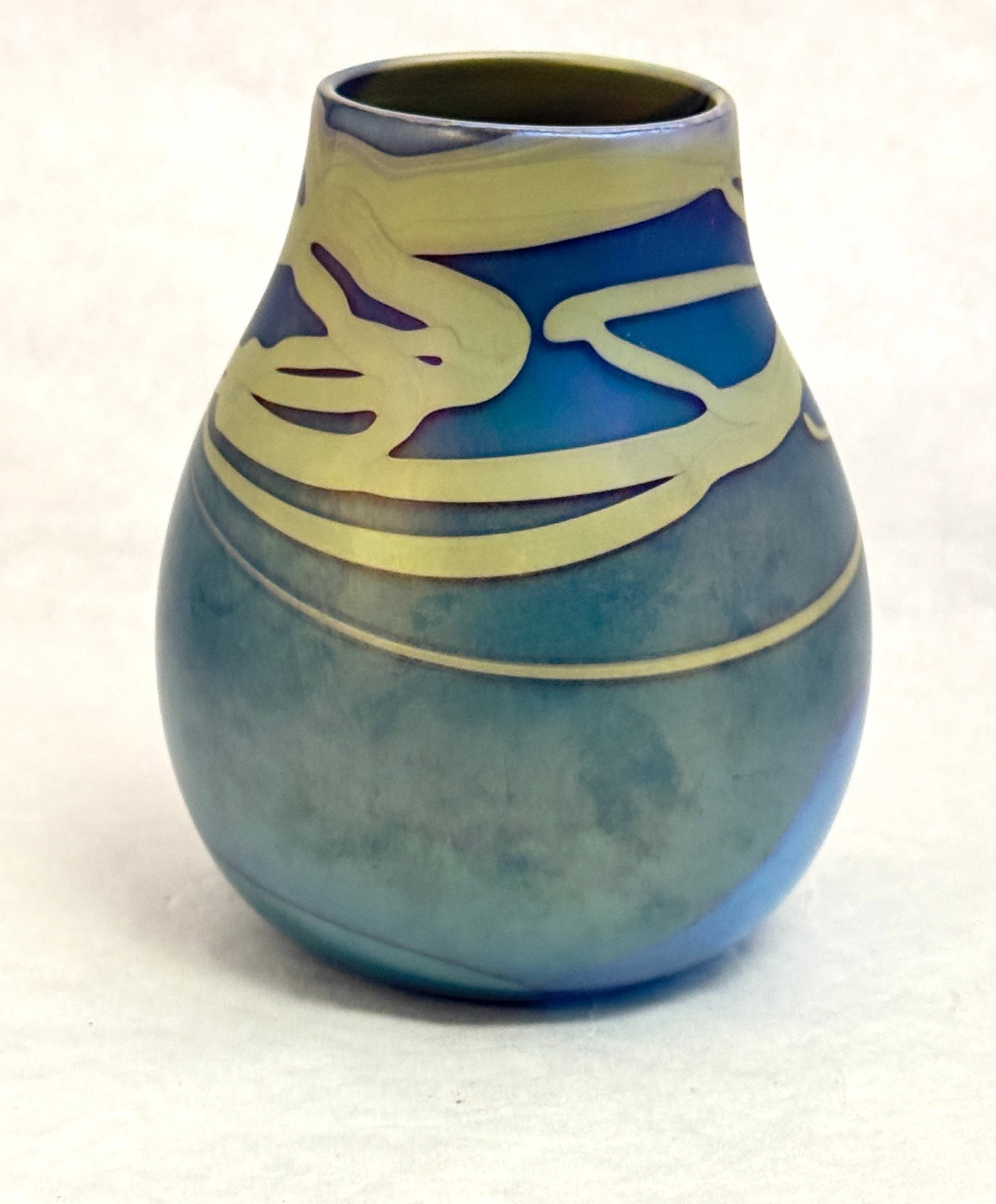 Charles Lotton Turquiose Vase: Charles Lotton turquoise blue vase decorated with a green and gold random ribbon, signed Lotton 1973, 5" ht. NOTE: Collection of Joan Allen Walker, an early collector of Lotton Glass and purchased