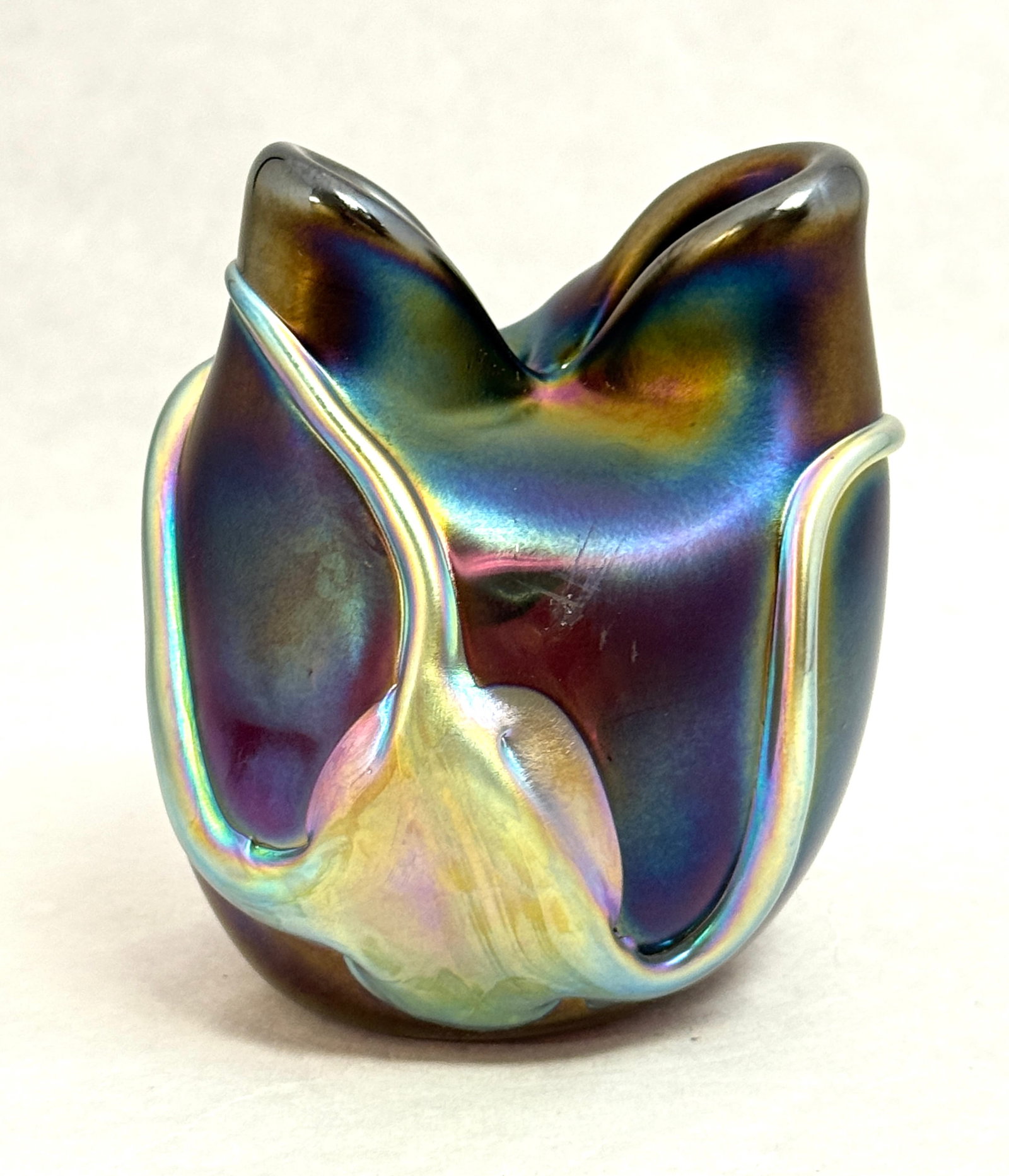 Charles Lotton Pinched Top Vase: Charles Lotton dark iridescent purple vase with a pinched top decorated with a gold lava flow, signed Lotton NOTE: Collection of Joan Allen Walker, an early collector of Lotton Glass and purchased ite