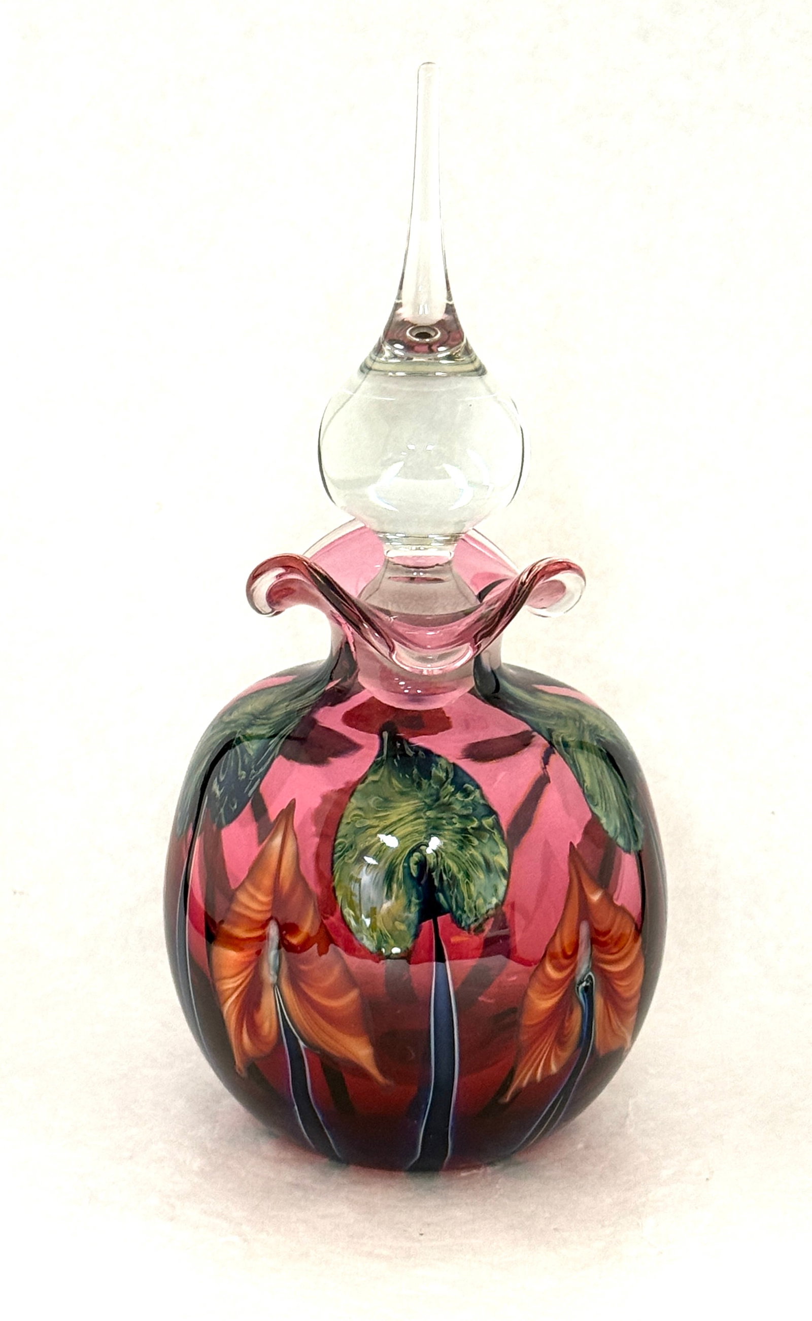 Red Charles Lotton Perfume: Large red Charles Lotton Multi Flora Perfume decorated with red flowers and green leaves, signed Charles Lotton 1992, 10 1/2" ht. CONDITION: no chips, cracks, repairs, or material defects found,