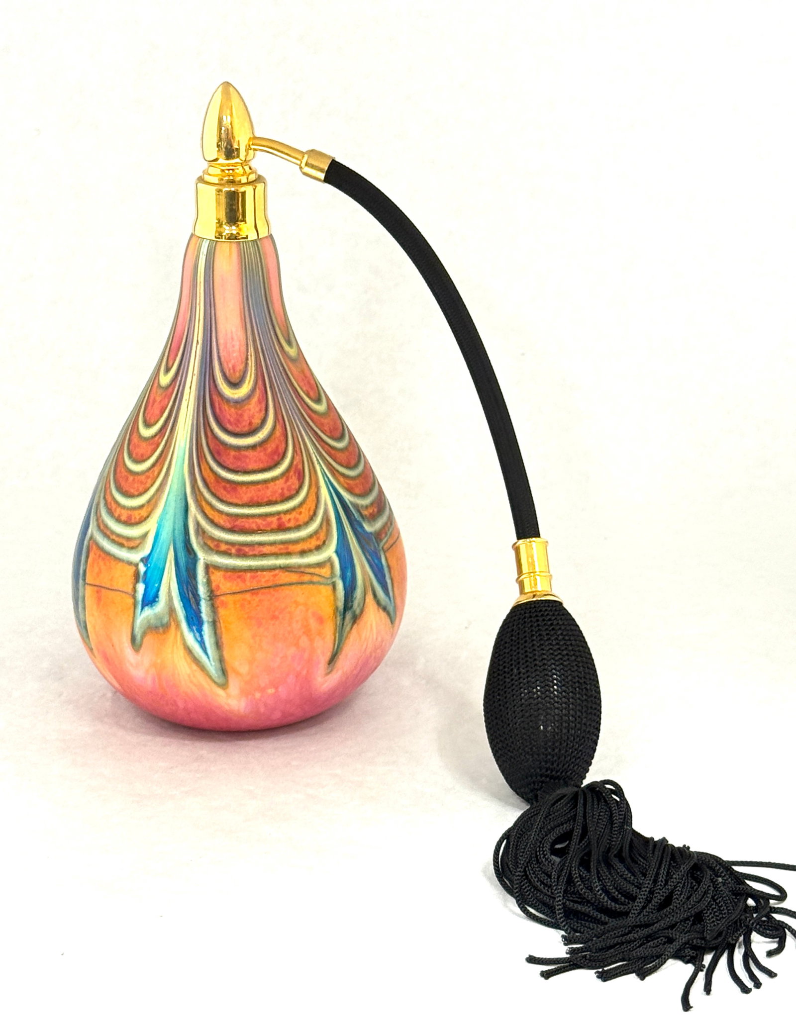 Daniel Lotton Red Atomizer: Daniel Lotton iridescent red atomizer decorated with cascading blue fox leaves, signed Daniel Lotton 1992, 7 1/2" ht. PROVENANCE: Humler Nolan. CONDITION: no chips, cracks, repairs, or material