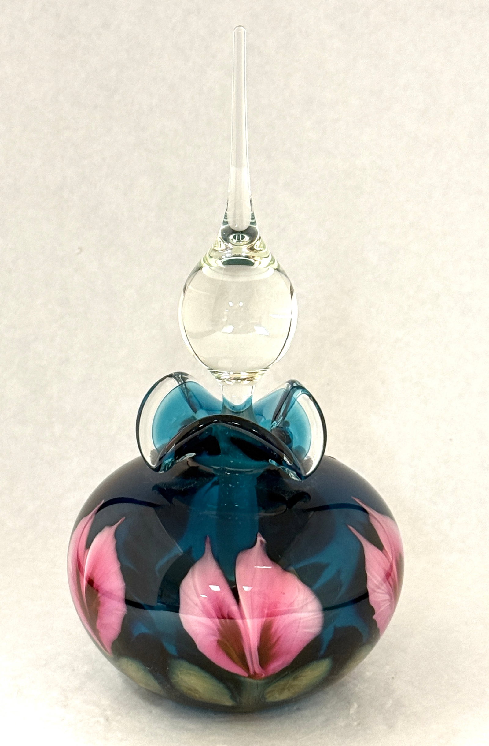 Daniel Lotton Blue Multi Flora: Daniel Lotton blue multi flora glass perfume decorated with large pink flowers, signed Daniel Lotton 1999, 10" ht. PROVENANCE: Humler Nolan. CONDITION: no chips, cracks, repairs, or material defects