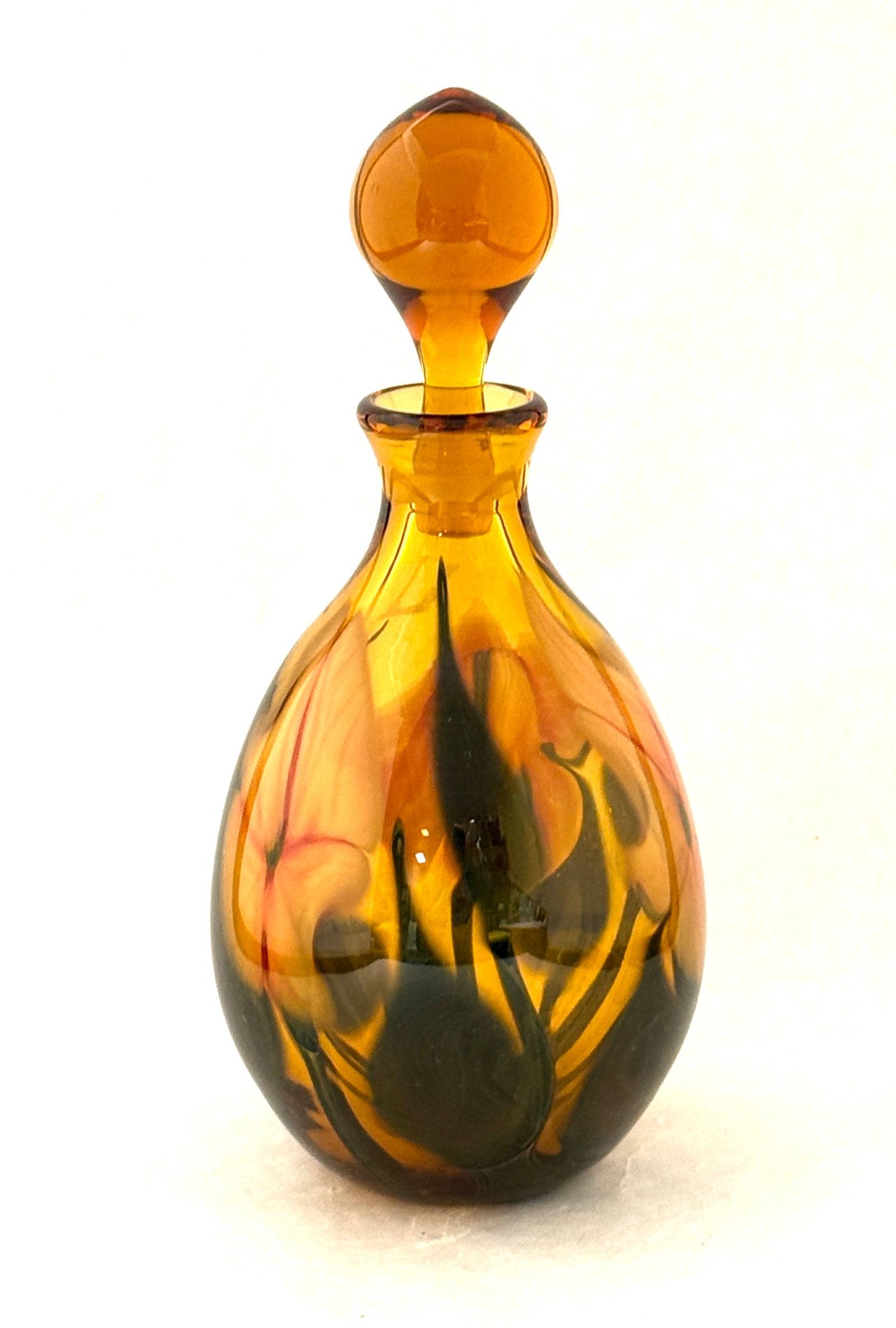 Charles Lotton Amber Perfume: Early Charles Lotton translucent amber glass perfume bottle decorated with pink flowers and green leaves, signed Charles Lotton 1978, 9 1/2" ht. CONDITION: no chips, cracks, repairs, or material