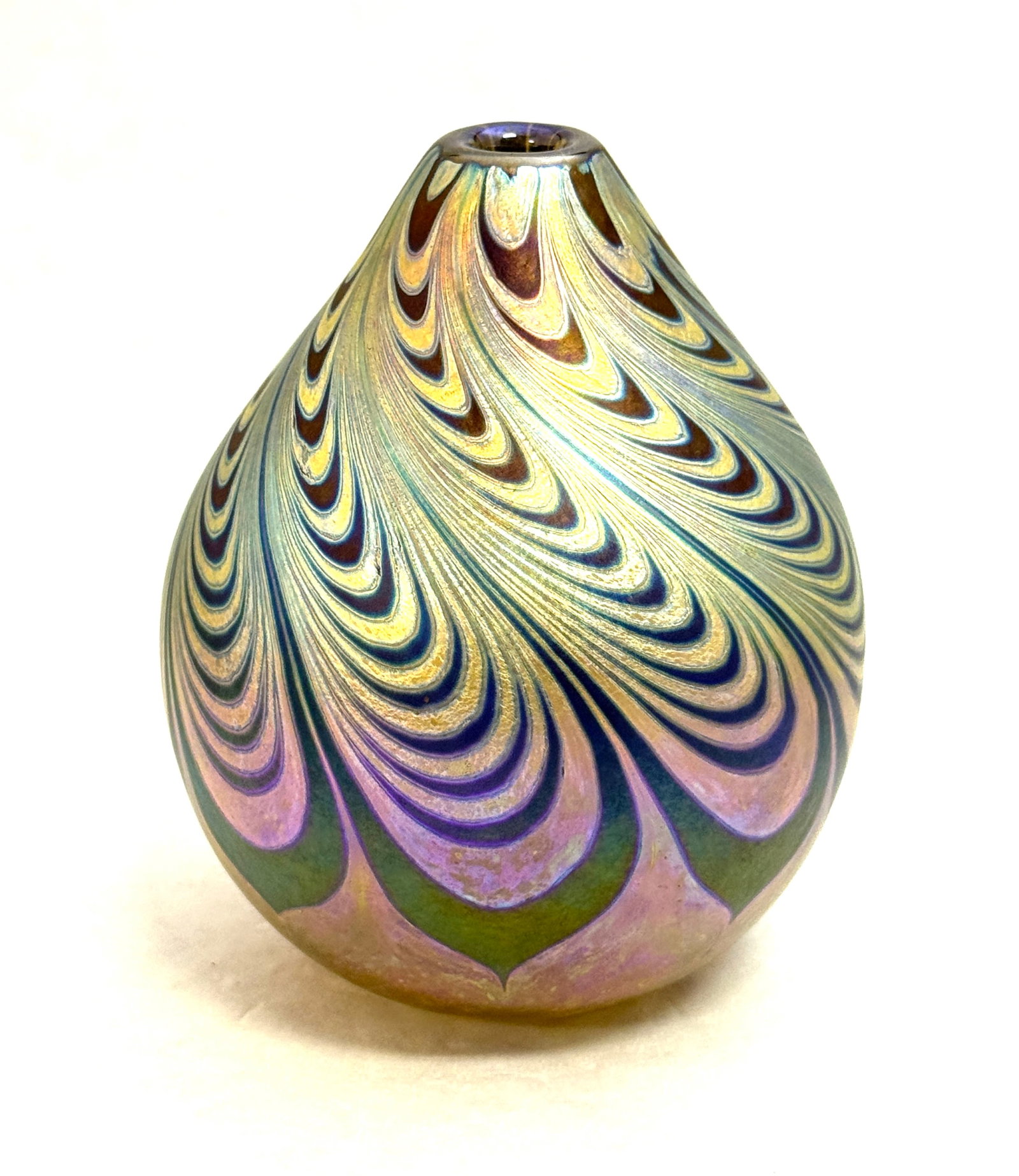 Maytum Art Glass Vase: Maytum small art glass vase iridescent with blue and silver pulled feather design, signed Maytum 1984; ht. 4 1/2". CONDITION: no chips, cracks, repairs, or material defects found, Jaremos attempts to 