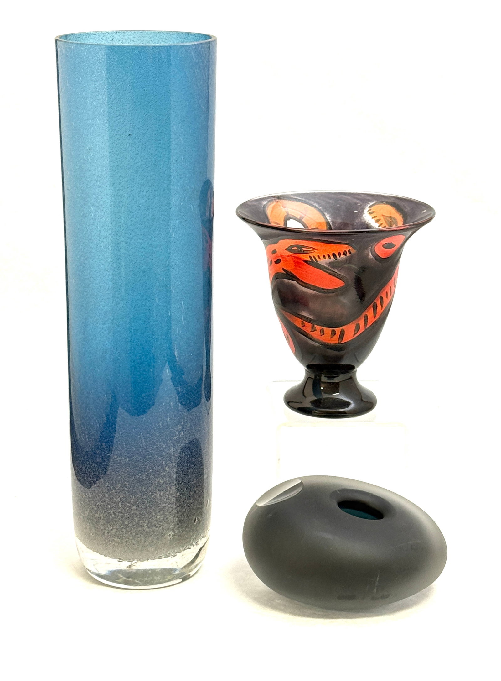 3Scandinavia n Glass Vases: Three Scandinavian glass vases including a black frosted paperweight, a footed Kosta Boda Atelier compote signed Ulrica Hydman, and a tall blue cylindrical Graal vase, tallest 11 1/2" ht. CONDITION: