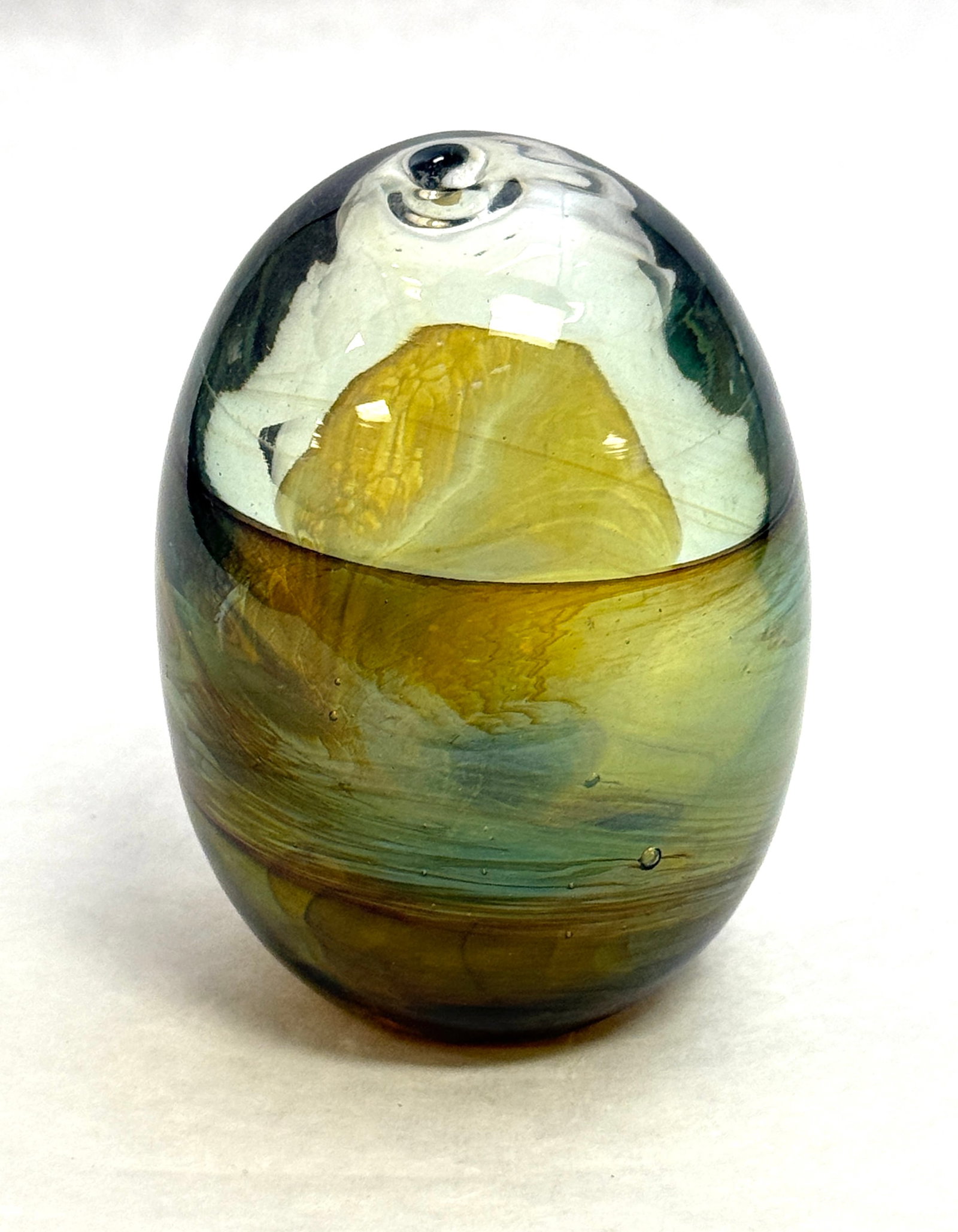 John Lewis Egg Paperweight: John Lewis egg form paperweight with wisps of green and opalescent glass on a clear background, signed Lewis, 3 1/2" ht. CONDITION: no chips, cracks, repairs, or material defects found, Jaremos