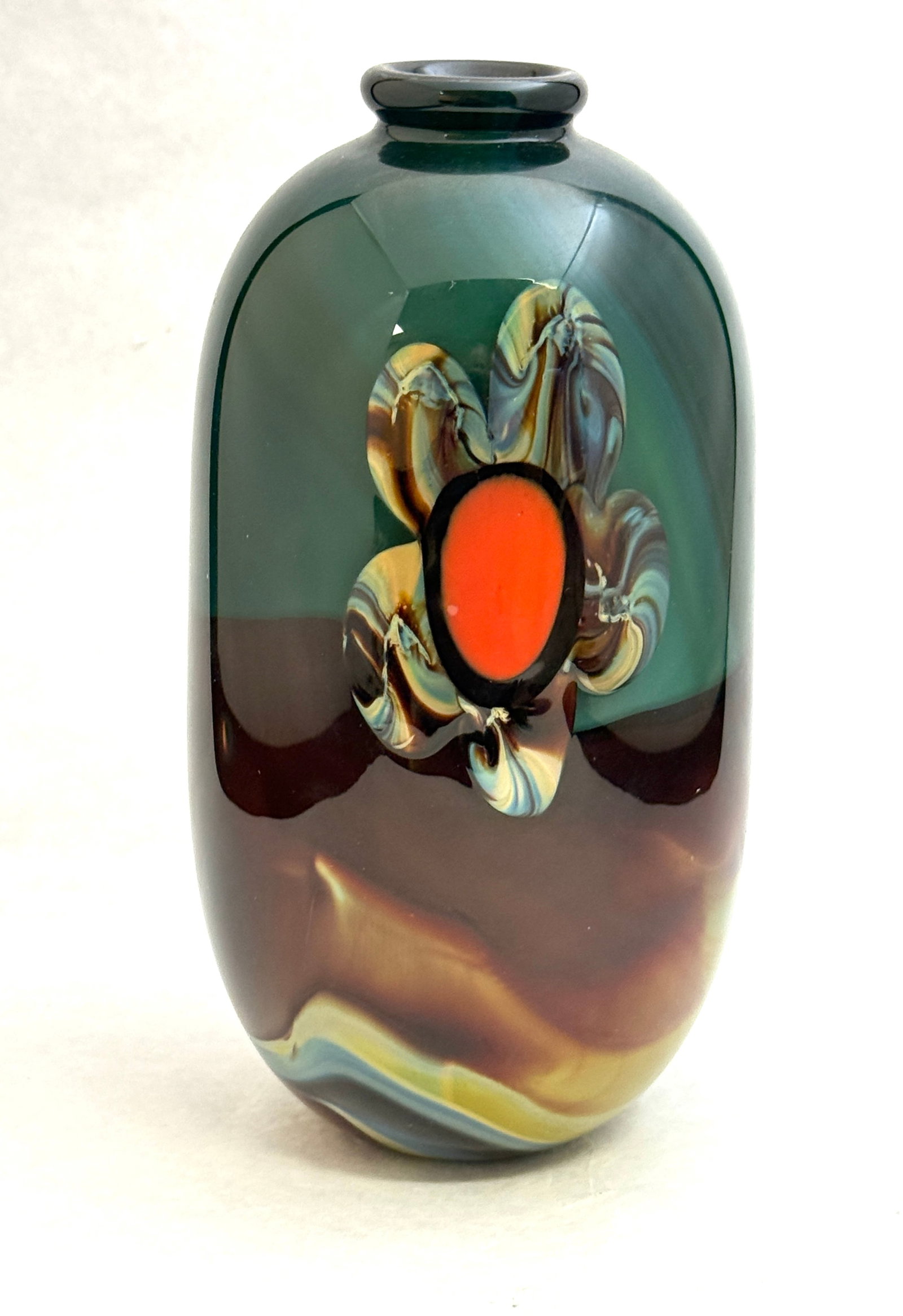 Michael Pavlik Paperweight Vase: Michael Pavlik green paperweight glass vase decorated with red stamen flowers on an agate background, signed Michael Pavlik 76, 8" ht. CONDITION: no chips, cracks, repairs, or material defects found, 